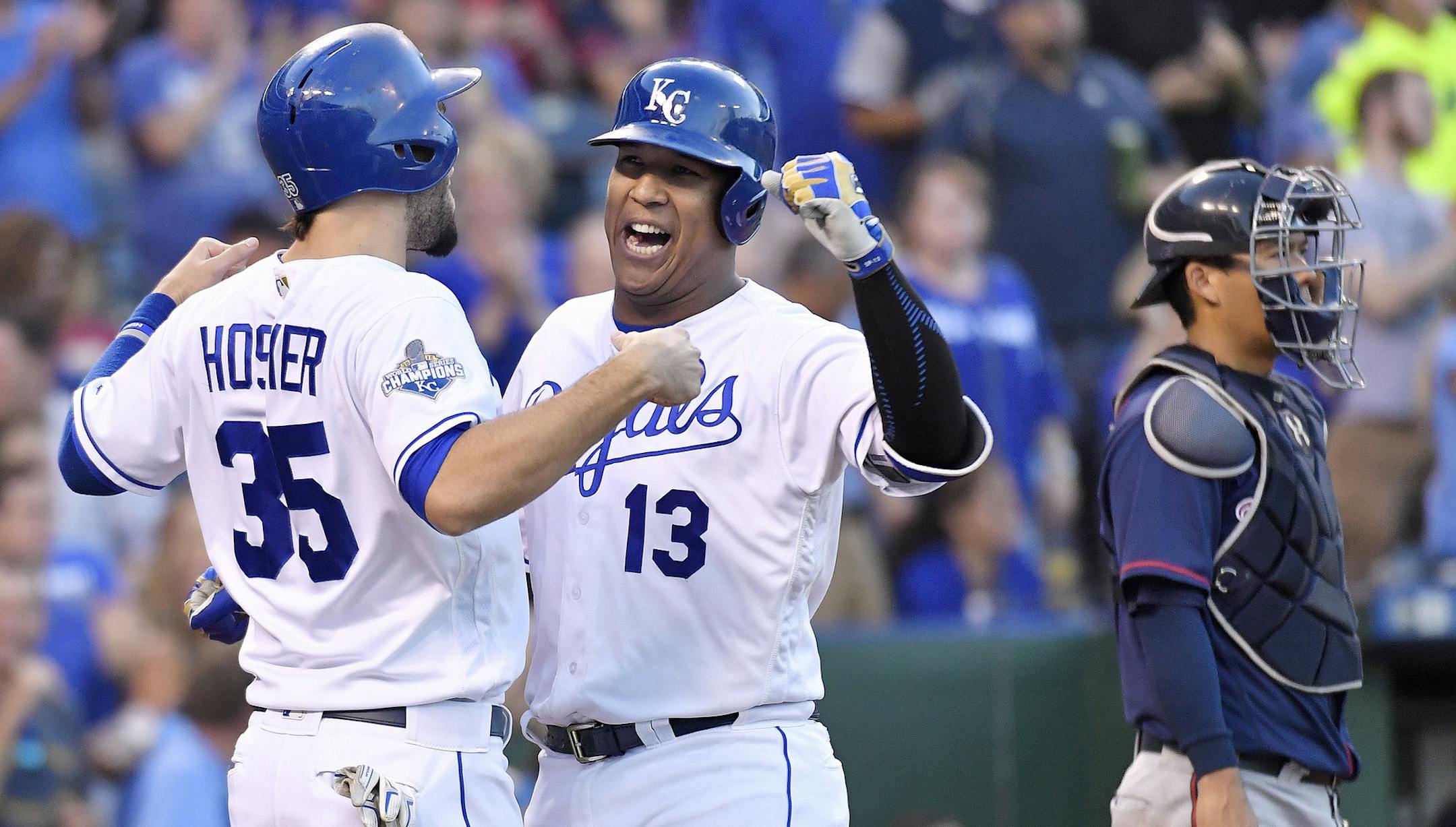 Kansas City Royals' Salvador Perez is greeted by Eric Hosmer behind Kansas City Royals third baseman Mike Moustakas after hitting a two run home run in the fifth inning during Saturday's baseball game on Aug. 20, 2016 at Kauffman Stadium in Kansas City, Mo. (John Sleezer/Kansas City Star/TNS)