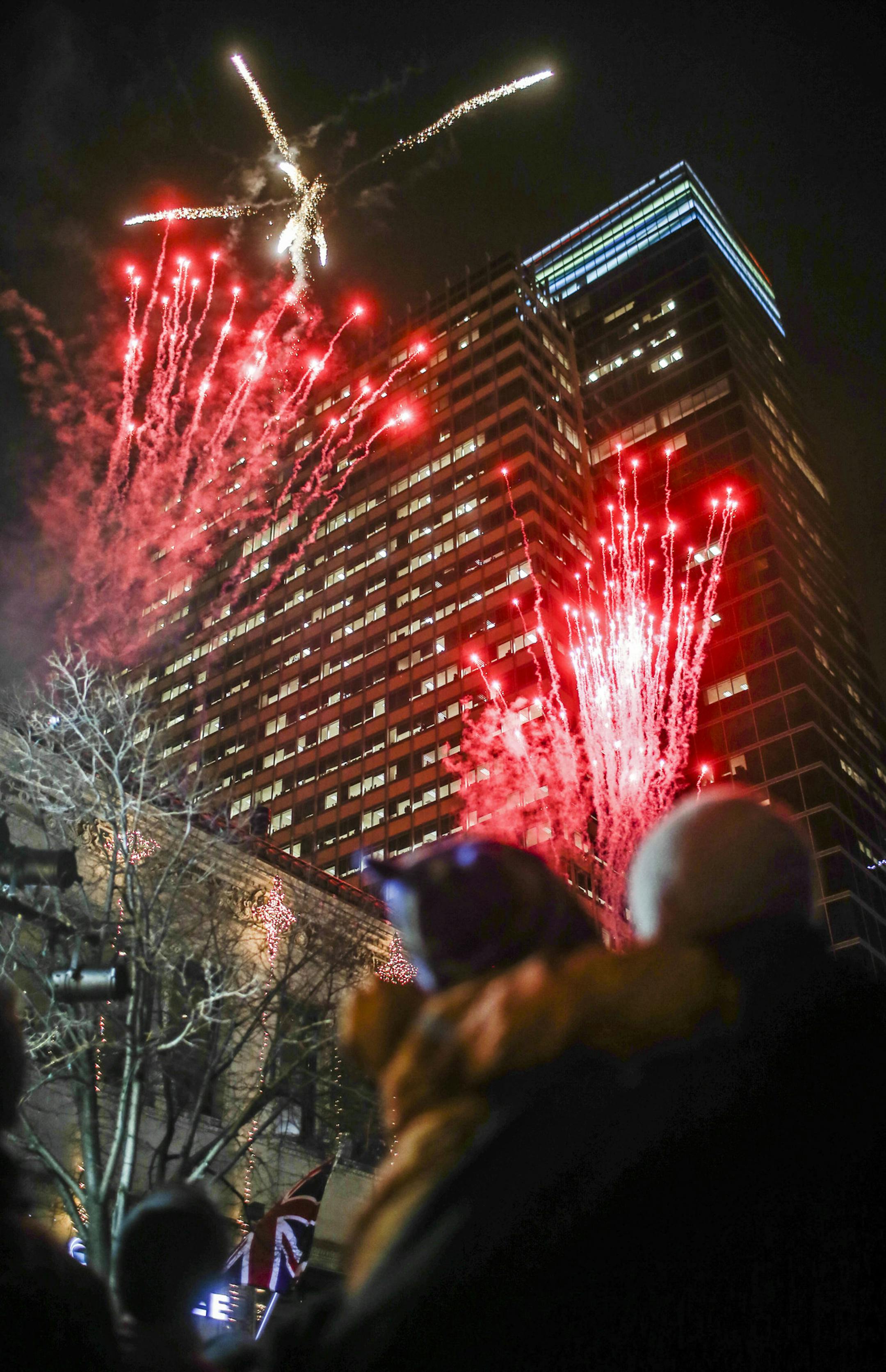 This is the first year of the reimagined Holidazzle, where it's Holidazzle Village, rather than the Holidazzle parade. Here, fireworks explode over the cold downtown Minneapolis skies from the roof of Vincent's at 11th and the Nicollet Mall Friday, Nov. 28, 2014.](DAVID JOLES/STARTRIBUNE)djoles@startribune This is the first year of the reimagined Holidazzle, where it's Holidazzle Village, rather than the Holidazzle parade