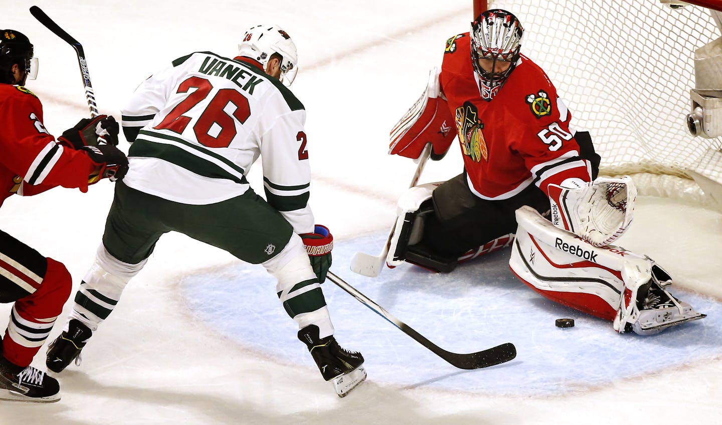 Blackhawks goalie Corey Crawford blocked a shot by Wild winger Thomas Vanek in Game 2.