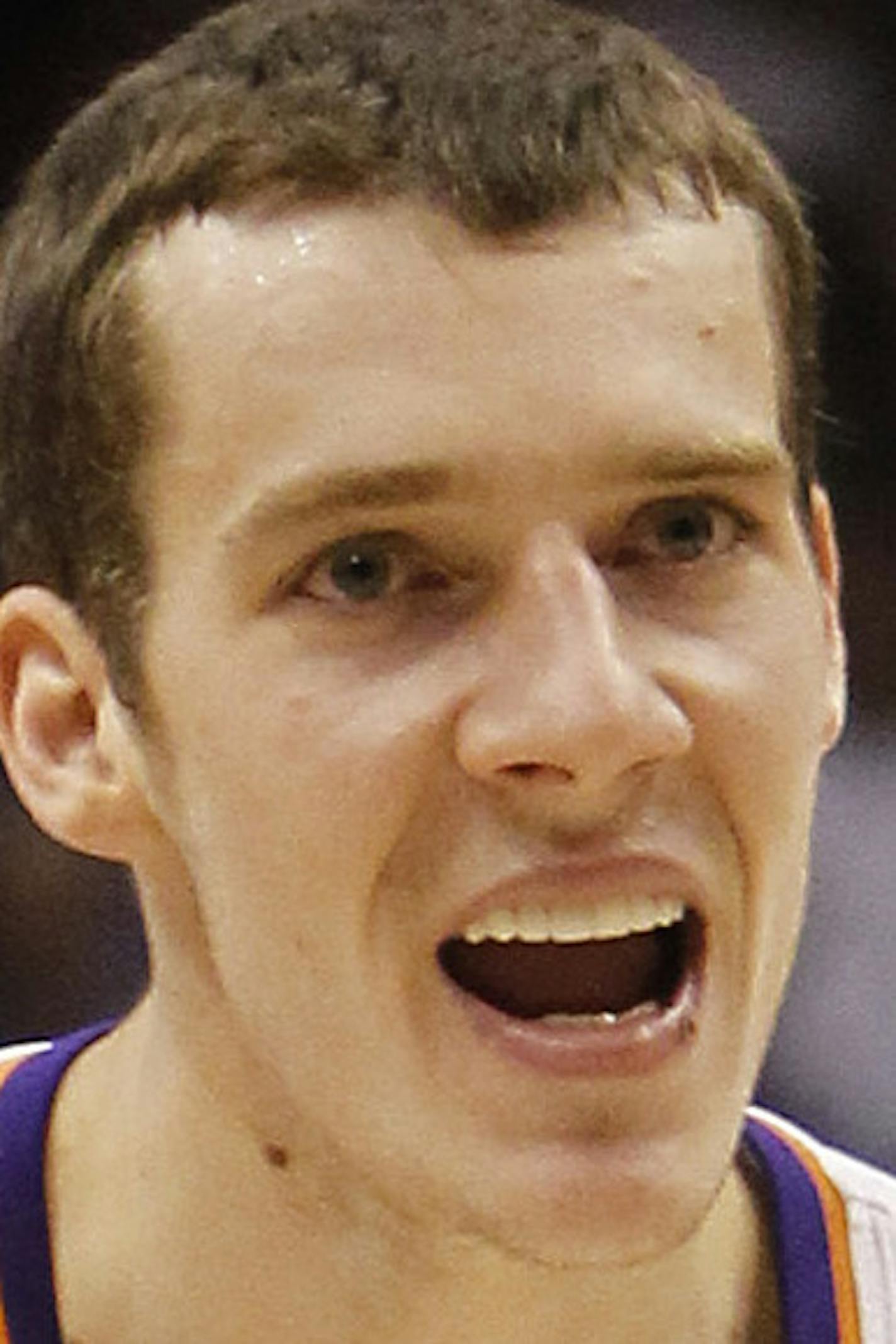 Phoenix Suns' Goran Dragic (2), of Slovenia, celebrates with teammate Vince Carter (25) after Carter scored against the New Jersey Nets in overtime of an NBA basketball game Wednesday, Jan. 12, 2011, in Phoenix. The Suns defeated the Nets 118-109. (AP Photo/Ross D. Franklin)