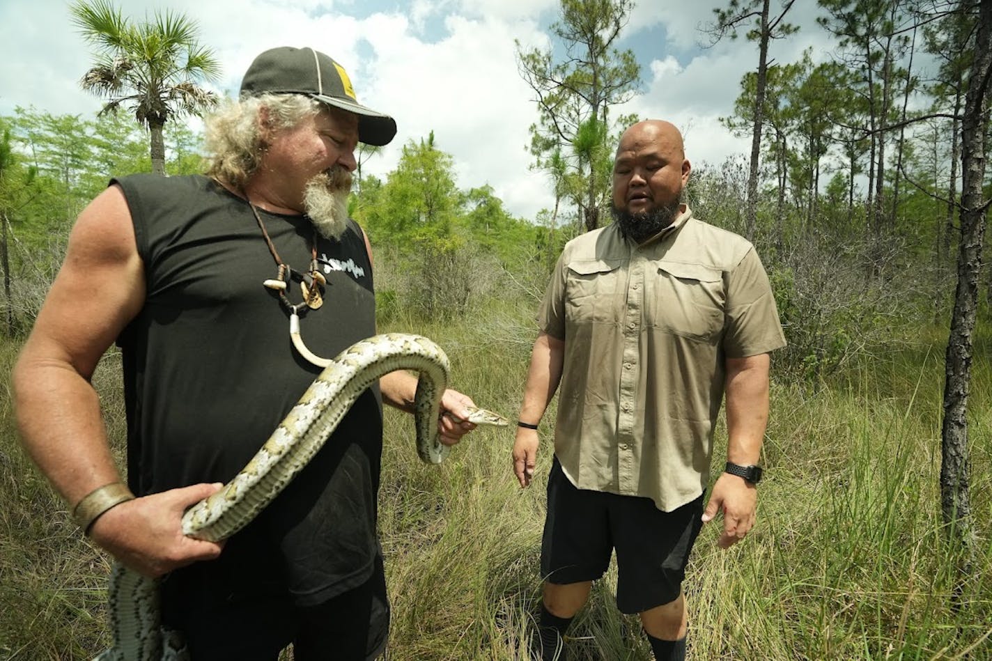 Yia Vang meets a snake on the new Outdoor Channel show "Feral"