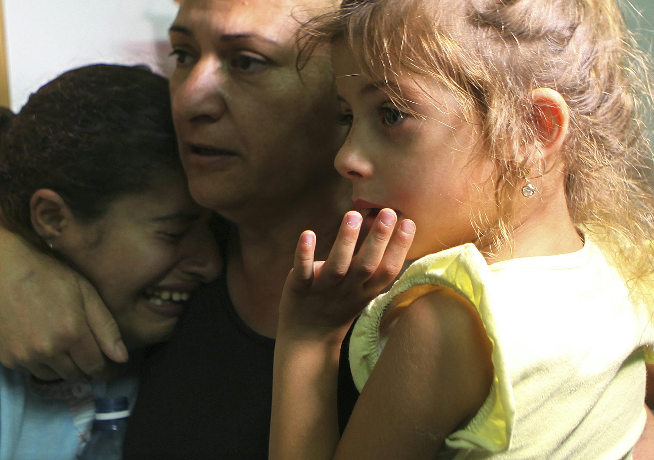 A woman cries as air raid sirens sound at an emergency shelter in Beersheba, Israel, July 12, 2014. During the past five days there have been injuries but no fatalities from the nearly 700 rockets and mortars fired into Israel from Gaza, though one home in Beersheba was destroyed by a rocket Friday night, injuring its elderly occupant. (Rina Castelnuovo/The New York Times) ORG XMIT: MIN2014071515152461