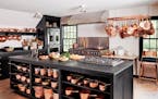 BC-ASK-MARTHA-KITCHEN-MAKEOVER-ART-NYTSF — Martha stores her copper pots and pans on an overhead rack near the stoves, where they are always easy to
