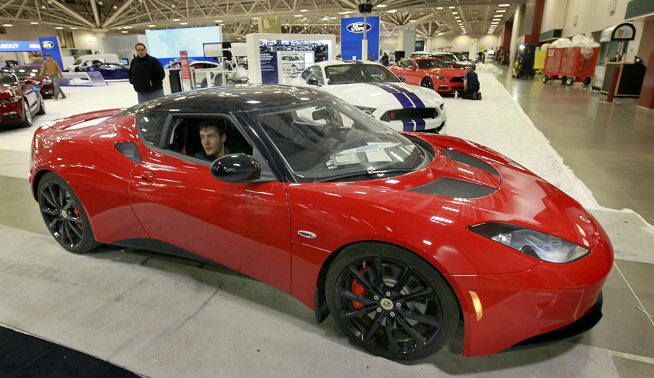 Sam Brock looked for a space to park the Lotus as they set up for the annual Minneapolis auto show, Friday, March 6, 2015 in Minneapolis, MN. The show starts Saturday at the Minneapolis Convention Center. ] (ELIZABETH FLORES/STAR TRIBUNE) ELIZABETH FLORES • eflores@startribune.com