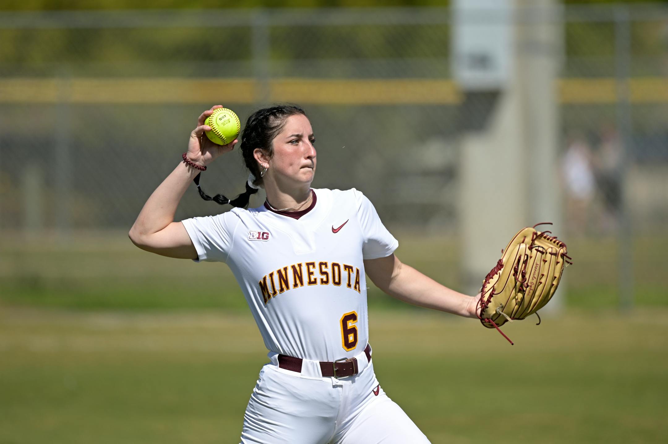 Minnesota's Chloe Evans (6) throws before an NCAA college softball game against Rutgers on Friday, March 12, 2021, in Leesburg, Fla. (AP Photo/Phelan M. Ebenhack)