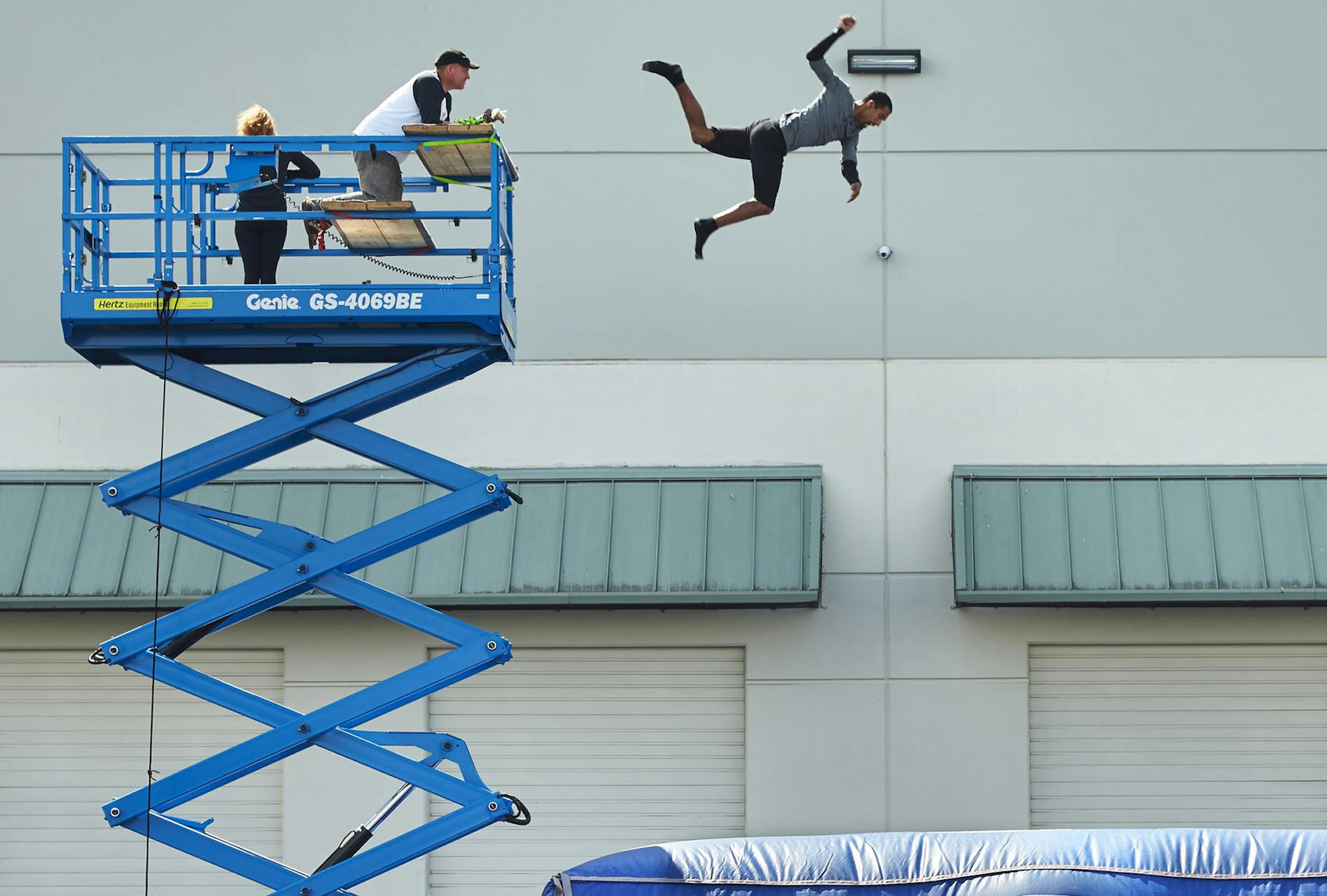 Diego Davila-Rivera practices a high fall.