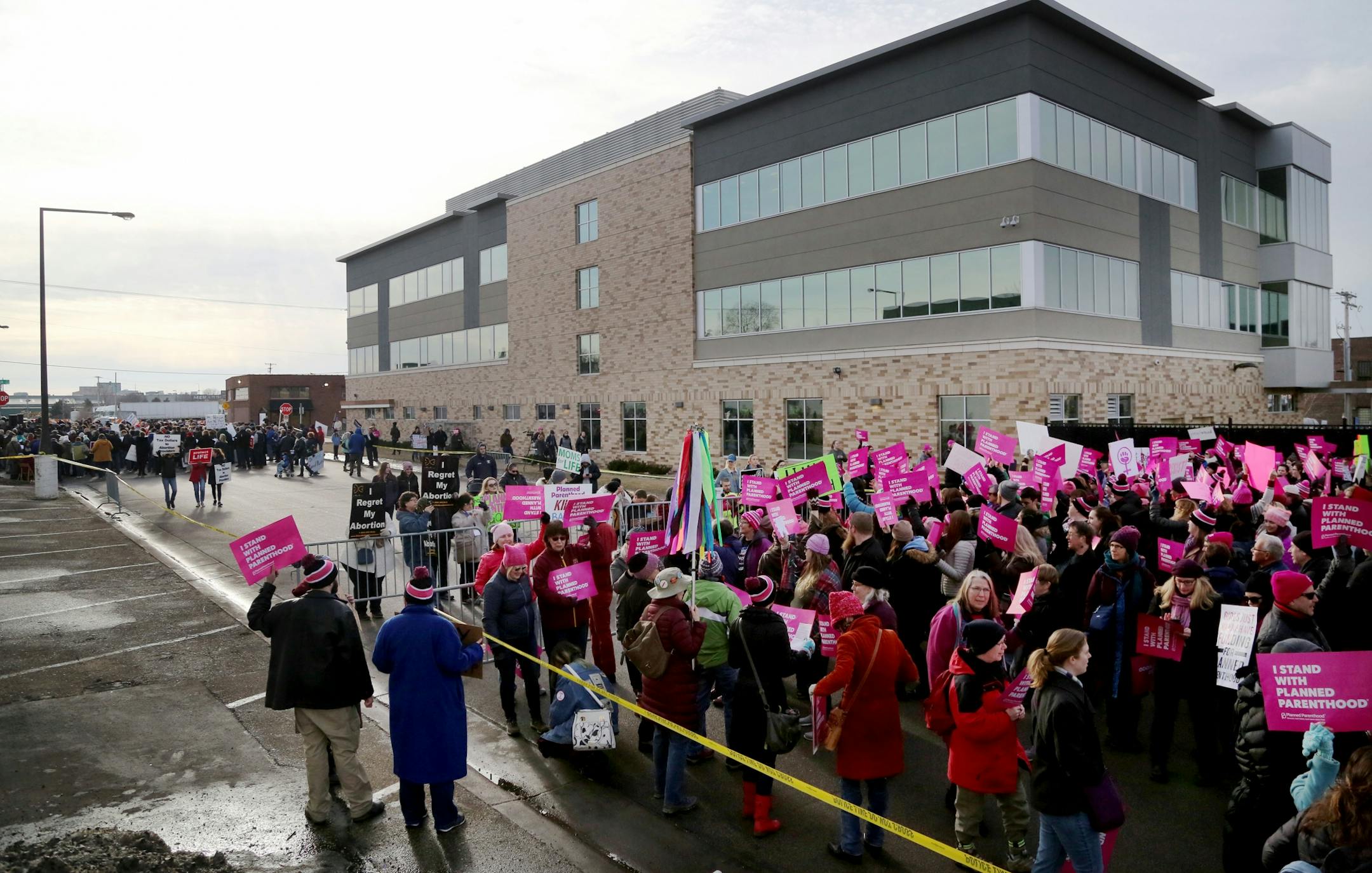 Pro-Life Action Ministries supporters, left, and the Defend Planned Parenthood supporters, right, both practiced their freedom of speech.