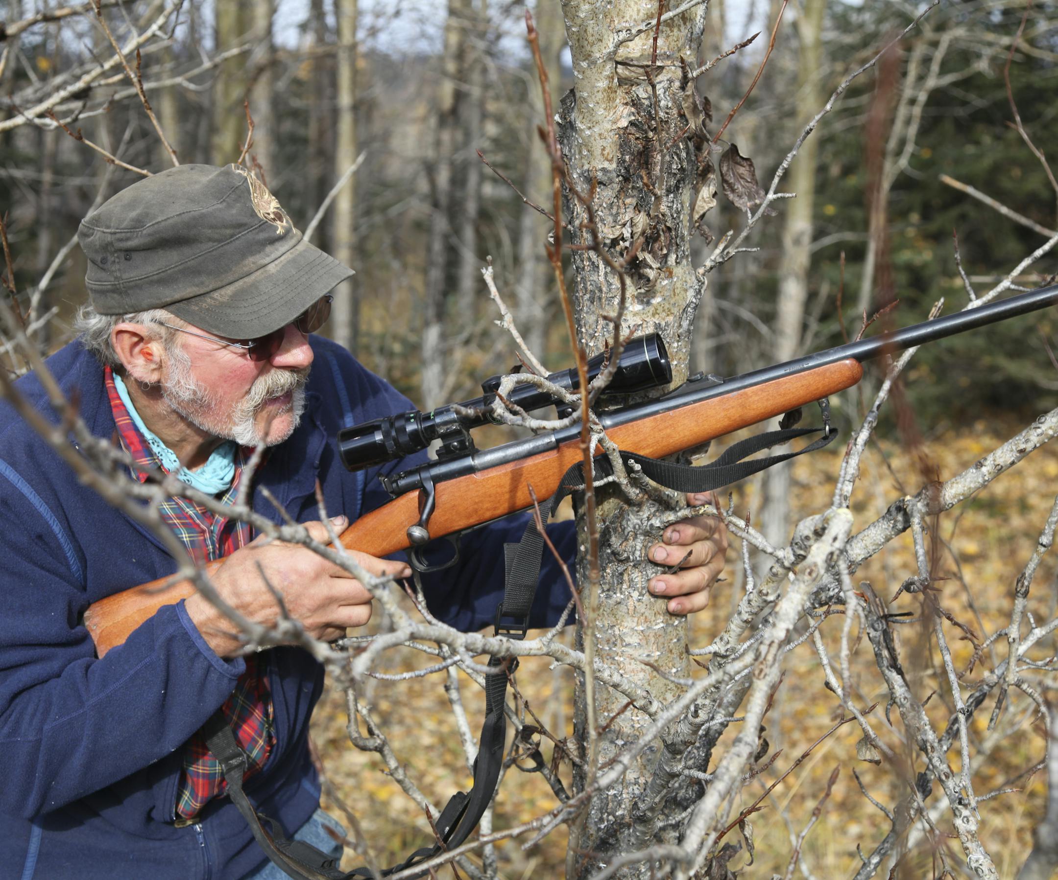 Atz Sr. with rifle. ORG XMIT: Producer Deliverable