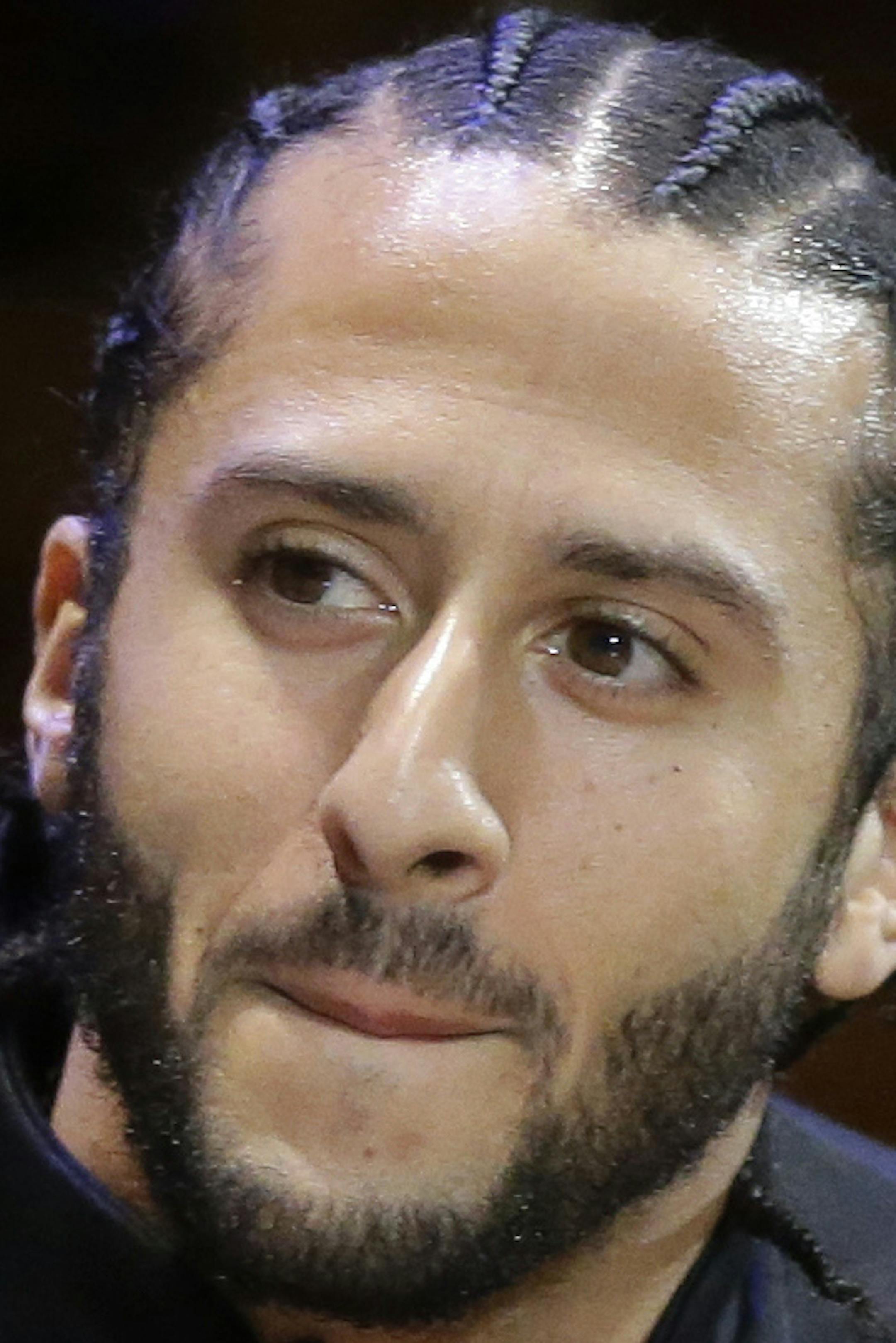FILE - In this Oct. 11, 2018, file photo, former NFL football quarterback Colin Kaepernick attends the W.E.B. Du Bois Medal ceremonies at Harvard University in Cambridge, Mass. Kaepernick was among eight recipients of Harvard University's W.E.B. Du Bois Medals in 2018. A person with knowledge of the conversation tells The Associated Press that the new Alliance of American Football spoke with Kaepernick during its development about joining the league. But Kaepernick wanted $20 million or more to