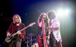 Aerosmith singer Steven Tyler, flanked by bassist Tom Hamilton and guitarist Joe Perry, performed in Philadelphia last fall before postponing other da