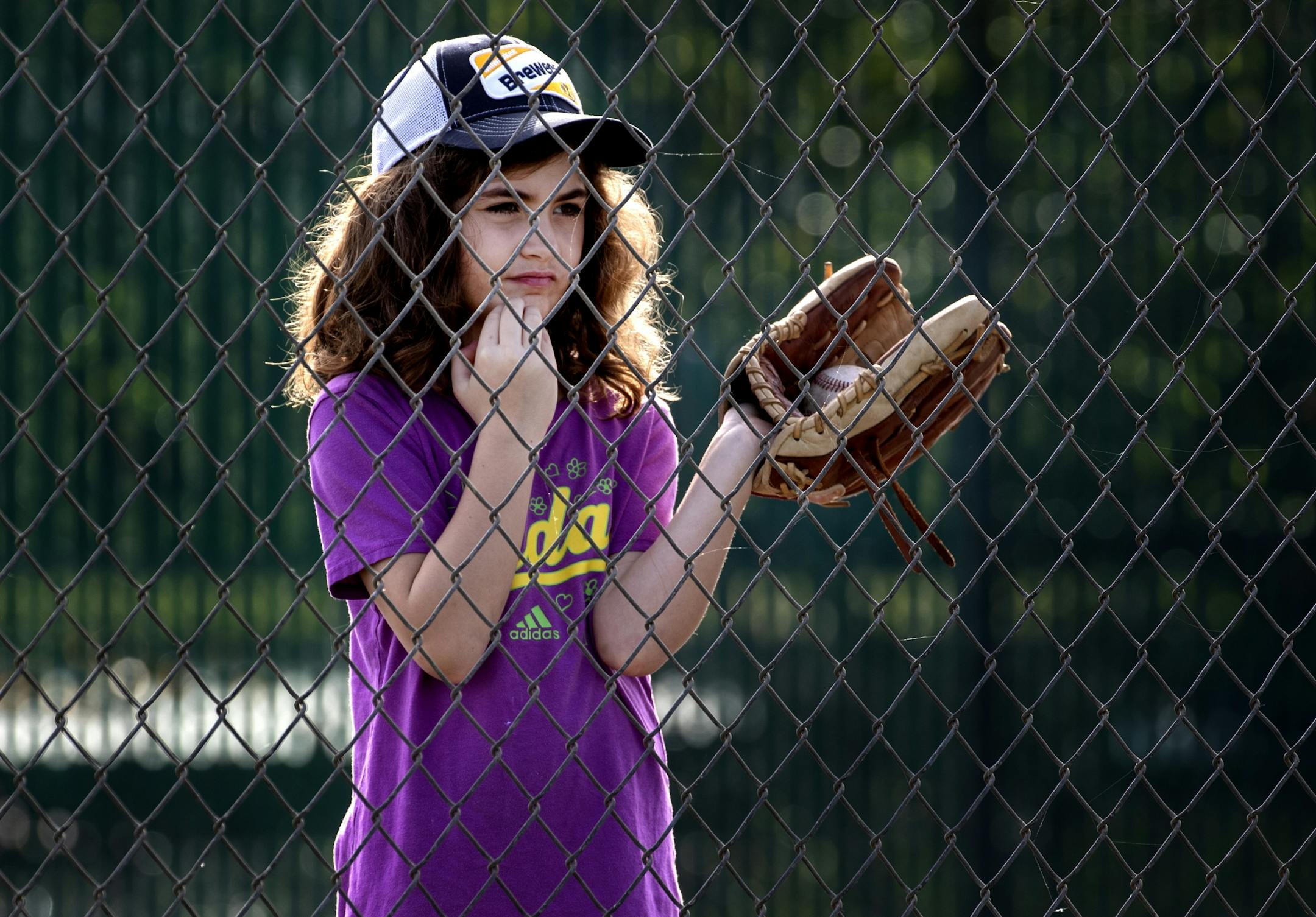 Emily Carnell, 7, of Milwaukee watched Minnesota Twins minor league players practice on Tuesday