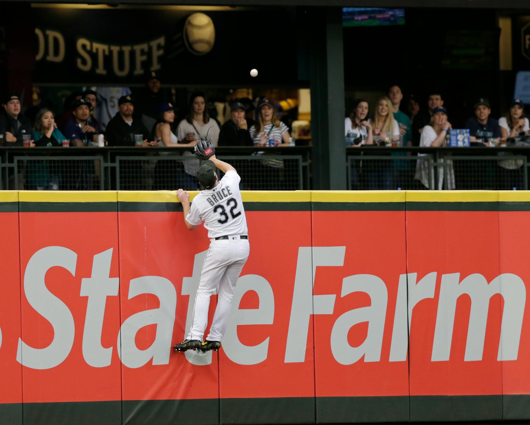Seattle Mariners left fielder Jay Bruce leaps at the wall in vain for a home run by Minnesota Twins' C.J. Cron during the second inning of a baseball game Saturday, May 18, 2019, in Seattle. (AP Photo/John Froschauer)