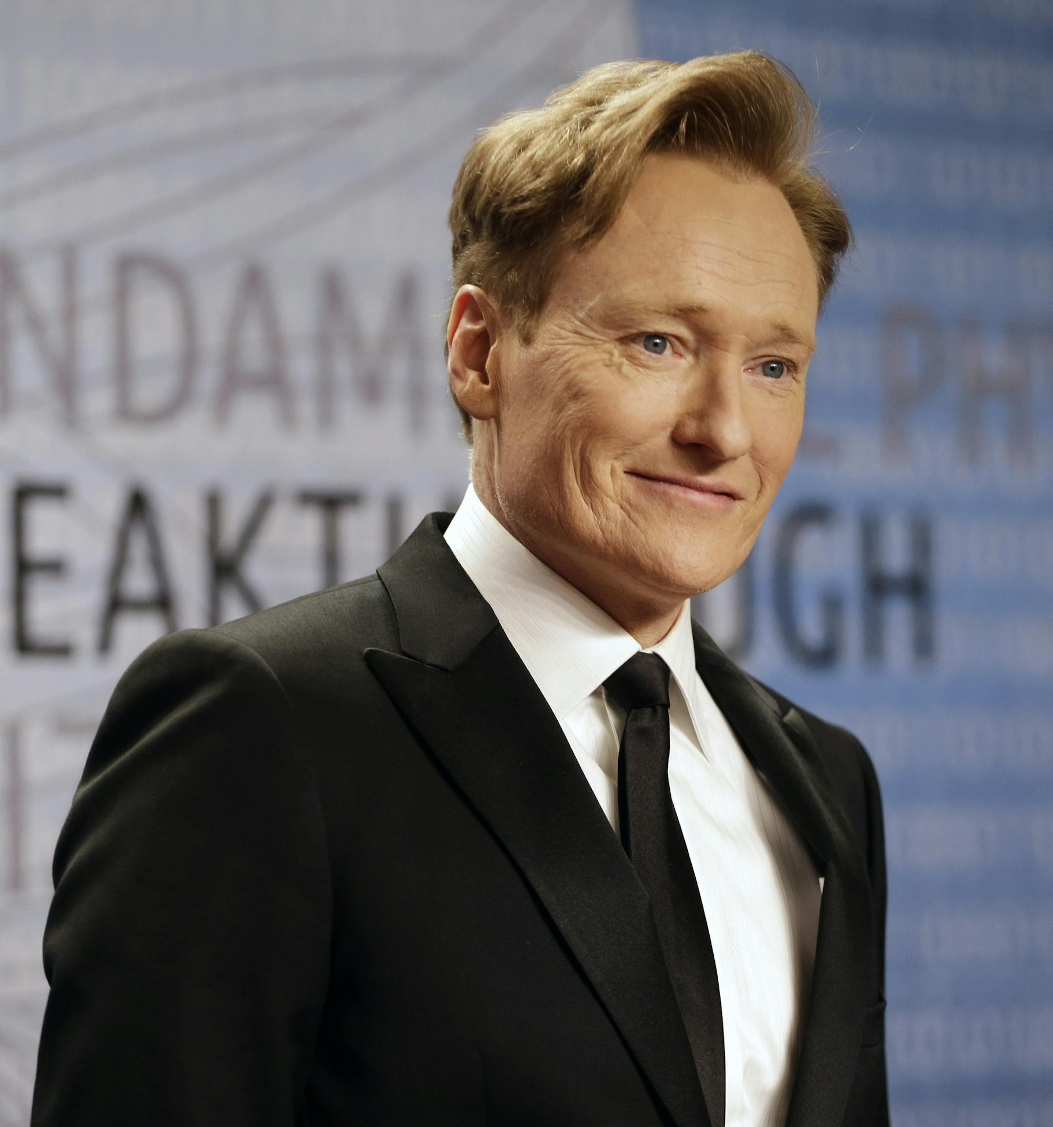 FILE - In this Dec. 12, 2013, file photo, talk show host Conan O'Brien arrives for the Breakthrough Prize in Life Sciences awards in Moffett Field, Calif. The TBS show "Conan" will be taped during 2015 Comic-Con International. The annual event runs July 9-12, 2015, at the San Diego Convention Center. (AP Photo/Ben Margot, File)