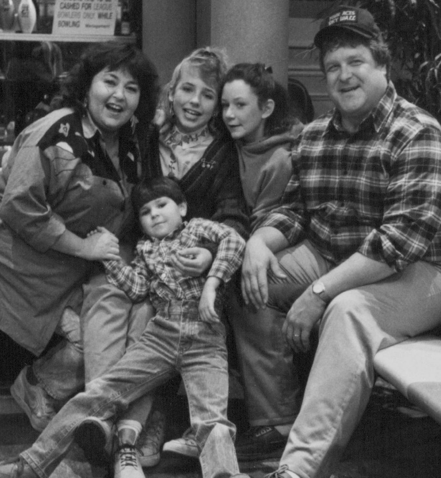 November 22, 1988 "Roseanne" - It's bowling night for Roseanne (series star Roseanne Bar, left) and family in "Lovers Lane," airing Tuesday, December 6 (8:30-9:00 p.m., ET), on the ABC Television Network. Starring as the family members are: (l to r) Michael Fishman (foreground), Lecy Goranson, Sara Gilbert and John Goodman. Roseanne Barr and John Goodman with their TV family: Michael Fishman, front; Lecy Goranson, Sara Gilbert. December 18, 1988 ABC