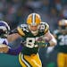 Green Bay Packers wide receiver Jordy Nelson (87) picked up a first down in the second quarter over Minnesota Vikings strong safety Andrew Sendejo (34