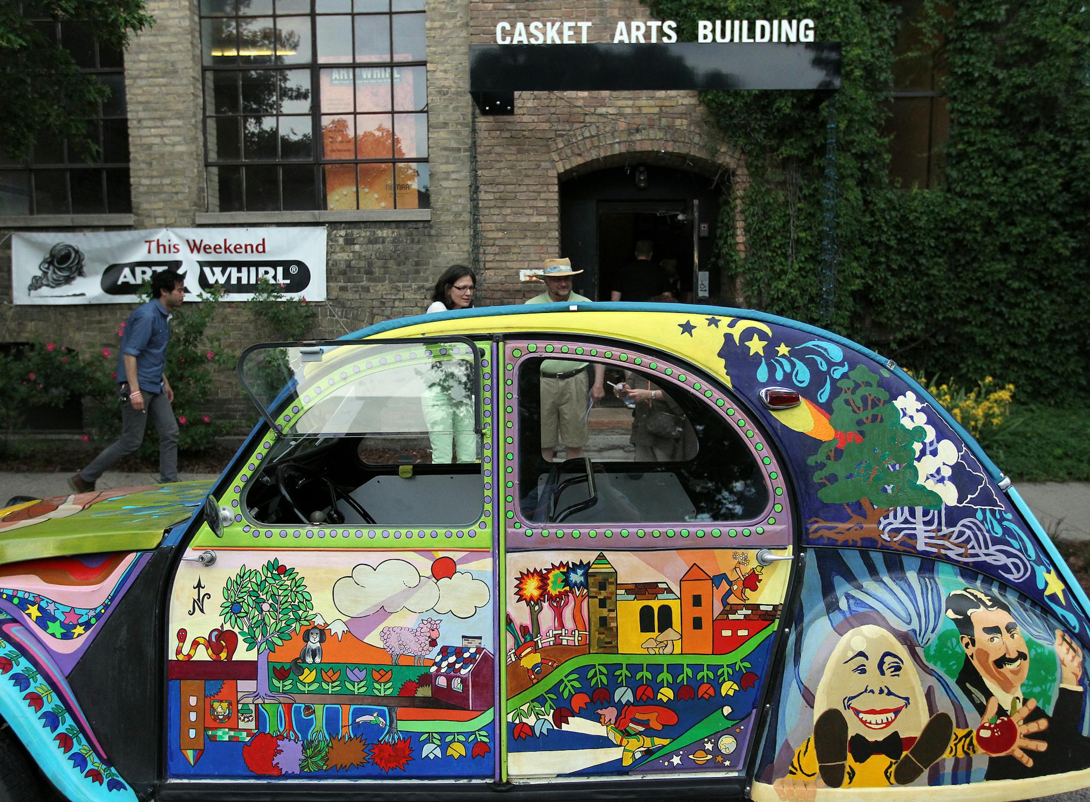 In the front of the Casket Building Friday during the first day of Art-A-Whirl. It takes place annually in Northeast Minneapolis, the third weekend of May. This event is free and open to the public. Saturday,¬† May 19th -¬† Noon-8:00 p.m. Sunday, May 20th -¬†¬† Noon-5:00 p.m. [ TOM WALLACE ‚Ä¢ twallace@startribune.com _ Assignments #20023600A_ May 15, 2012_ SLUG: artawhirl0519_ EXTRA INFORMATION:Sponsored by the Northeast Minneapol