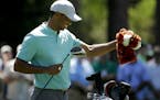 Tiger Woods pulls out his driver on the seventh hole during a practice round for the Masters golf tournament Wednesday, April 10, 2019, in Augusta, Ga