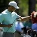 Tiger Woods pulls out his driver on the seventh hole during a practice round for the Masters golf tournament Wednesday, April 10, 2019, in Augusta, Ga
