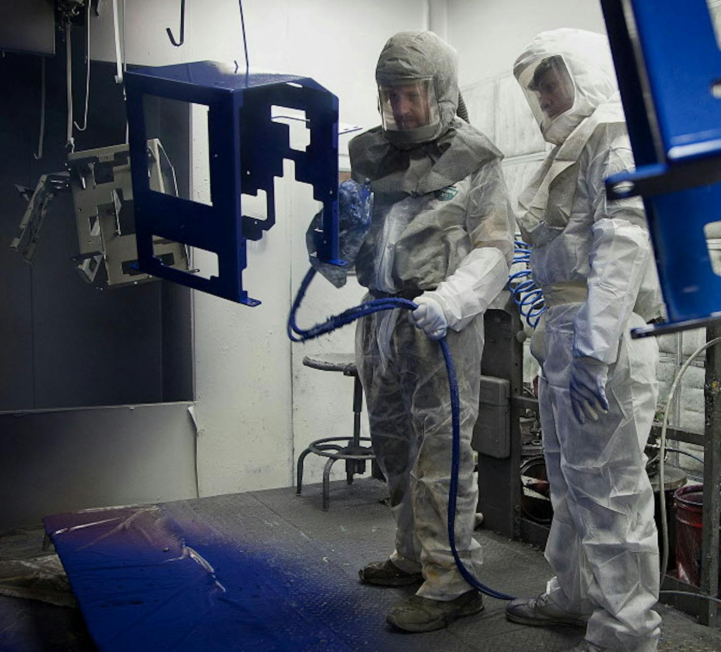 Employee Joe Stelflug, left, and trainee Dwane Whekins paint chassis at the Graco Inc. manufacturing facility in Minneapolis, Minnesota, U.S., on Tuesday, Feb. 5, 2013. The U.S. Federal Reserve is scheduled to release manufacturing production figures on Feb. 15. Photographer: Ariana Lindquist/Bloomberg *** Local Caption *** Joe Stelflug; Dwane Whekins ORG XMIT: 161819514 ORG XMIT: MIN1307011700470833