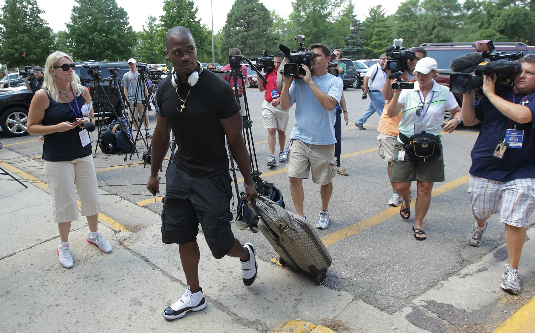 Vikings running back Adrian Peterson arrived at Gage Hall as Vikings players report for football camp Thursday July 26, 2012 Mankato ,MN .