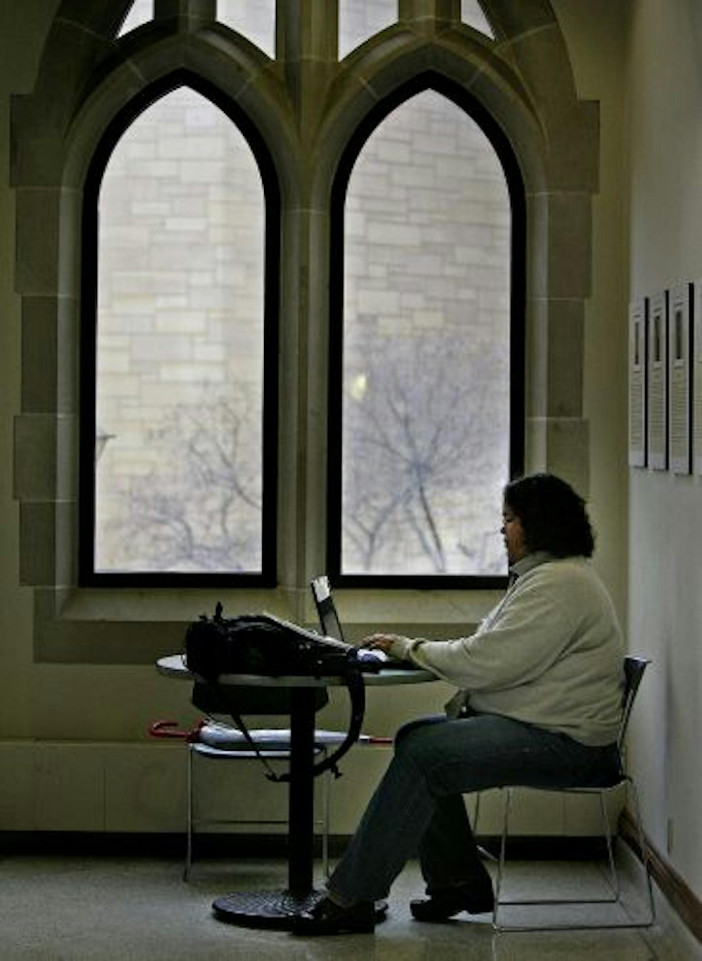 St. Thomas junior Melissa Martinez found a quiet spot at the University of St. Thomas to write a paper. The junior will take part next year in the Tommie Law Early Admission program for minority students.