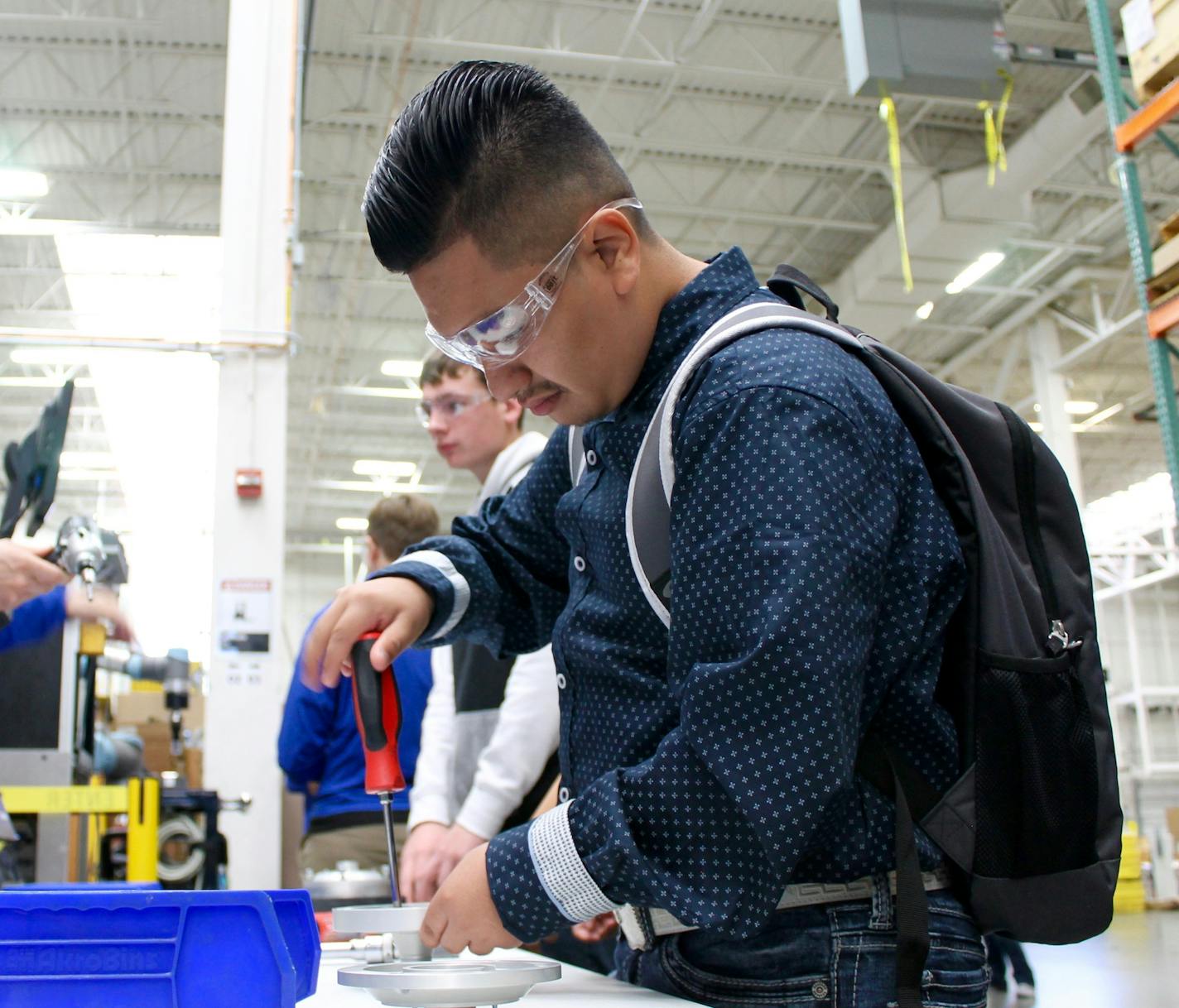 Jose Garcia Jr., a student at Minneapolis Roosevelt High School, learned about assembly at the Graco plant in Minneapolis. submitted by Graco