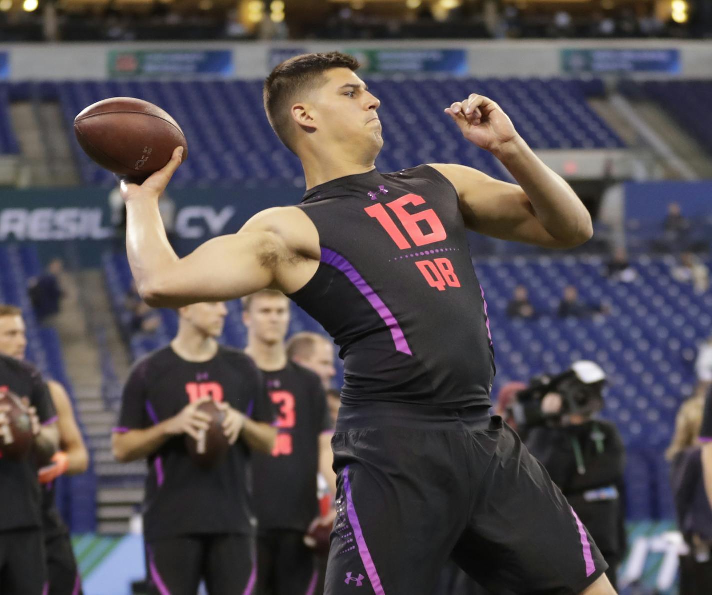 Oklahoma State quarterback Mason Rudolph throws during a drill at the NFL football scouting combine in Indianapolis, Saturday, March 3, 2018. (AP Photo/Michael Conroy)