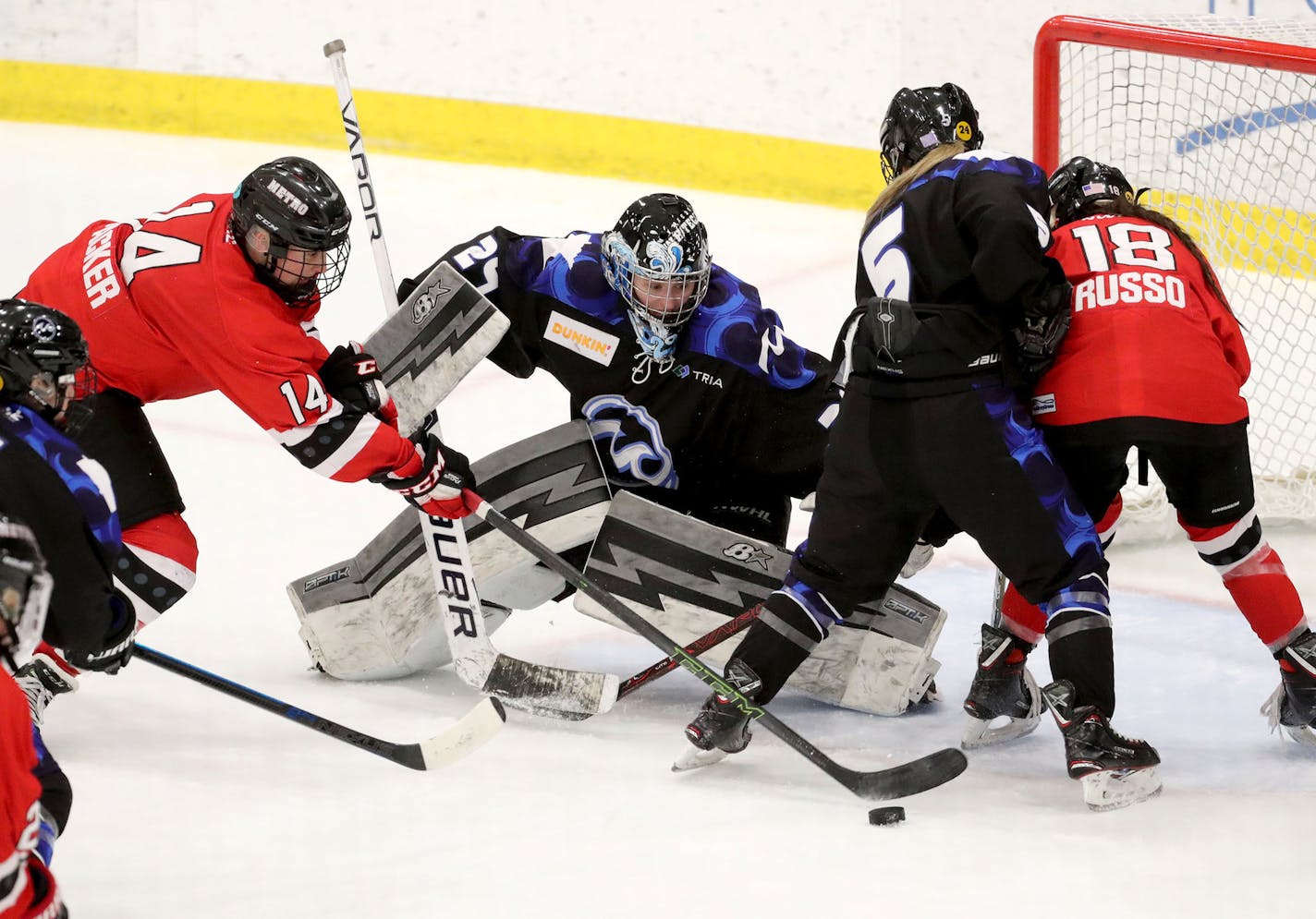 Minnesota Whitecaps goalie Amanda Leveiville (29) denies a shot by the Metropolitan Riveters Madison Packer (14) bench during the third period of the Whitecaps 5-1 win over the Riveters in the NWHL semifinals Friday, March 15, 2019, at Tria Rink in St. Paul, MN.] DAVID JOLES &#x2022;david.joles@startribune.com Game coverage of NWHL semifinal between the Whitecaps and Riveters