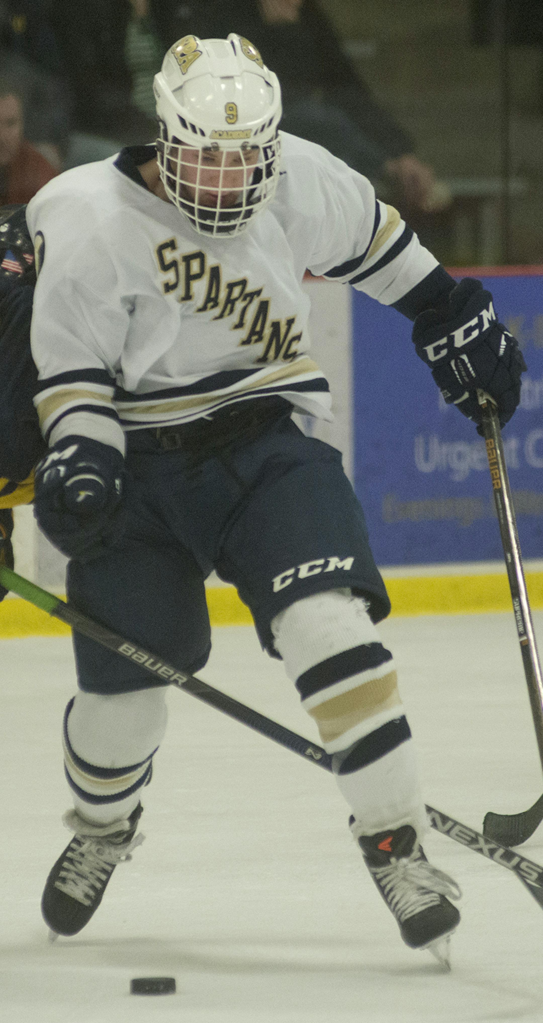 St. Paul Academy's Devlin McCabe keeps his eye on the puck as he weaves around Totino-Grace's Nick Holtan during the second period of the Boys' Class 1A Section 4 State Hockey Final, Feb. 26, 2016, at the Roseville Ice Arena in Roseville, Minn. ] (Matthew Hintz, 022616, Roseville)
