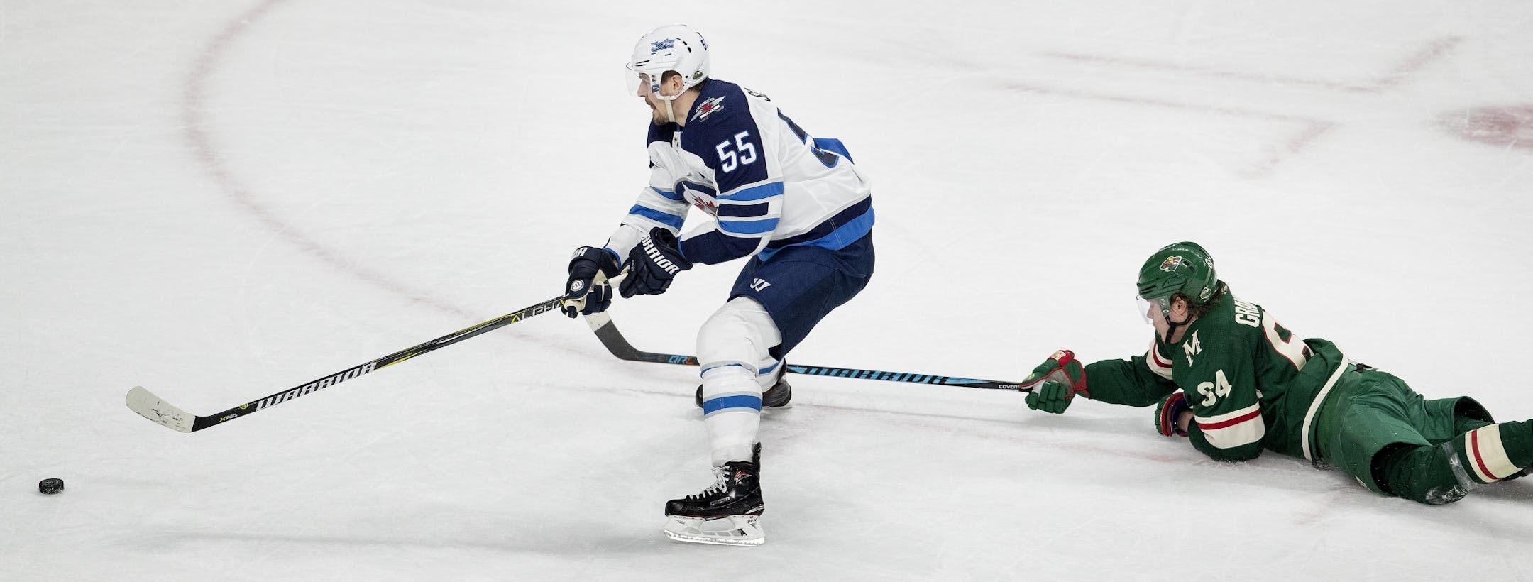 Mark Scheifele (55) broke away from Mikael Granlund (64) to score an empty net goal in the third period.