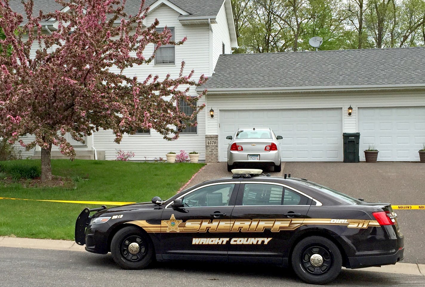 An off-duty Elk River police officer and another man were shot and killed in a home in St. Michael, and one of the officer&#xed;s sons was arrested, officials said Sunday. Elk River Mayor John J. Dietz said Todd Besser was killed in what he characterized as &#xec;a domestic type&#xee; incident Saturday night. The killings occurred in a house in the 4500 block of Mayfield Avenue, (IN THE PHOTO) according to authorities. The identity of the other person killed has not be released by authorities. ]