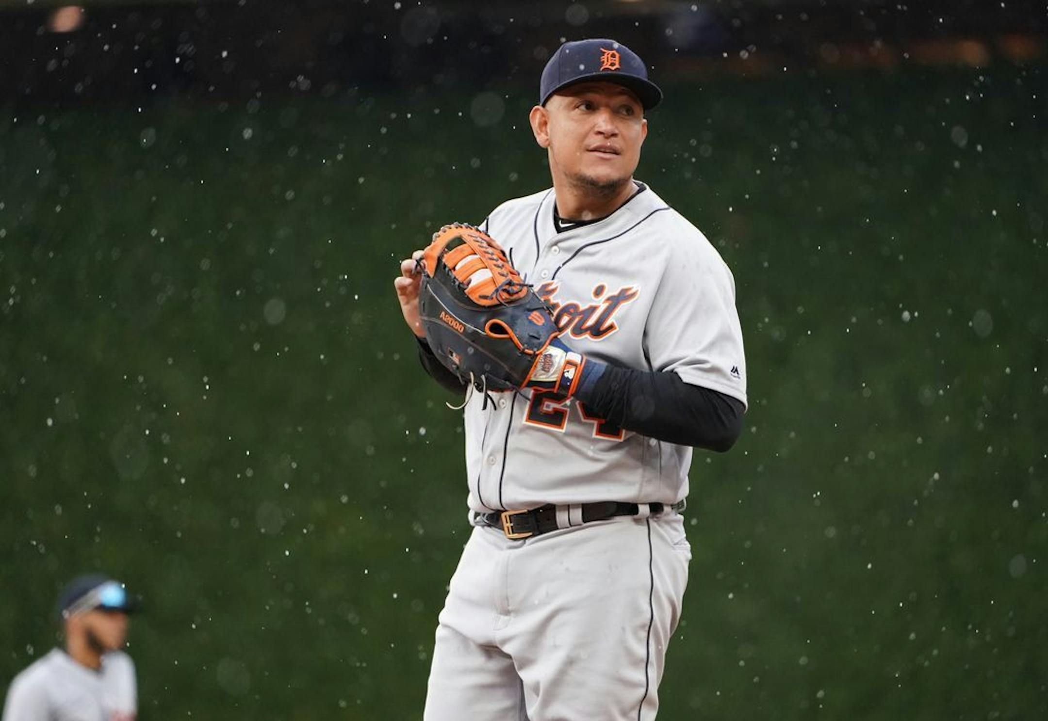 Detroit Tigers first baseman Miguel Cabrera (24) waited for the bottom of the seventh inning to start as light rain fell at Target Field.