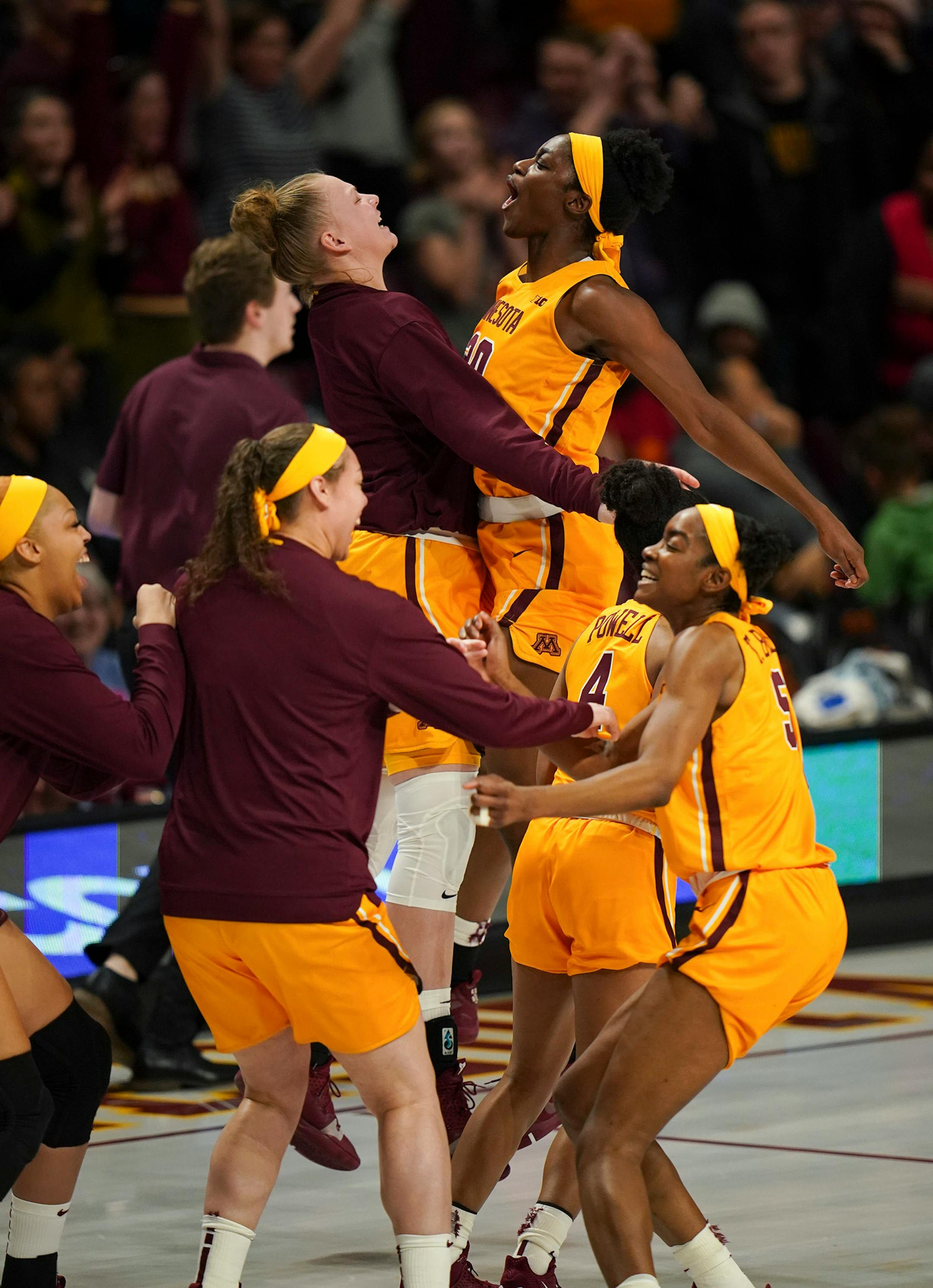 Gophers players celebrated the double overtime win over Rutgers.