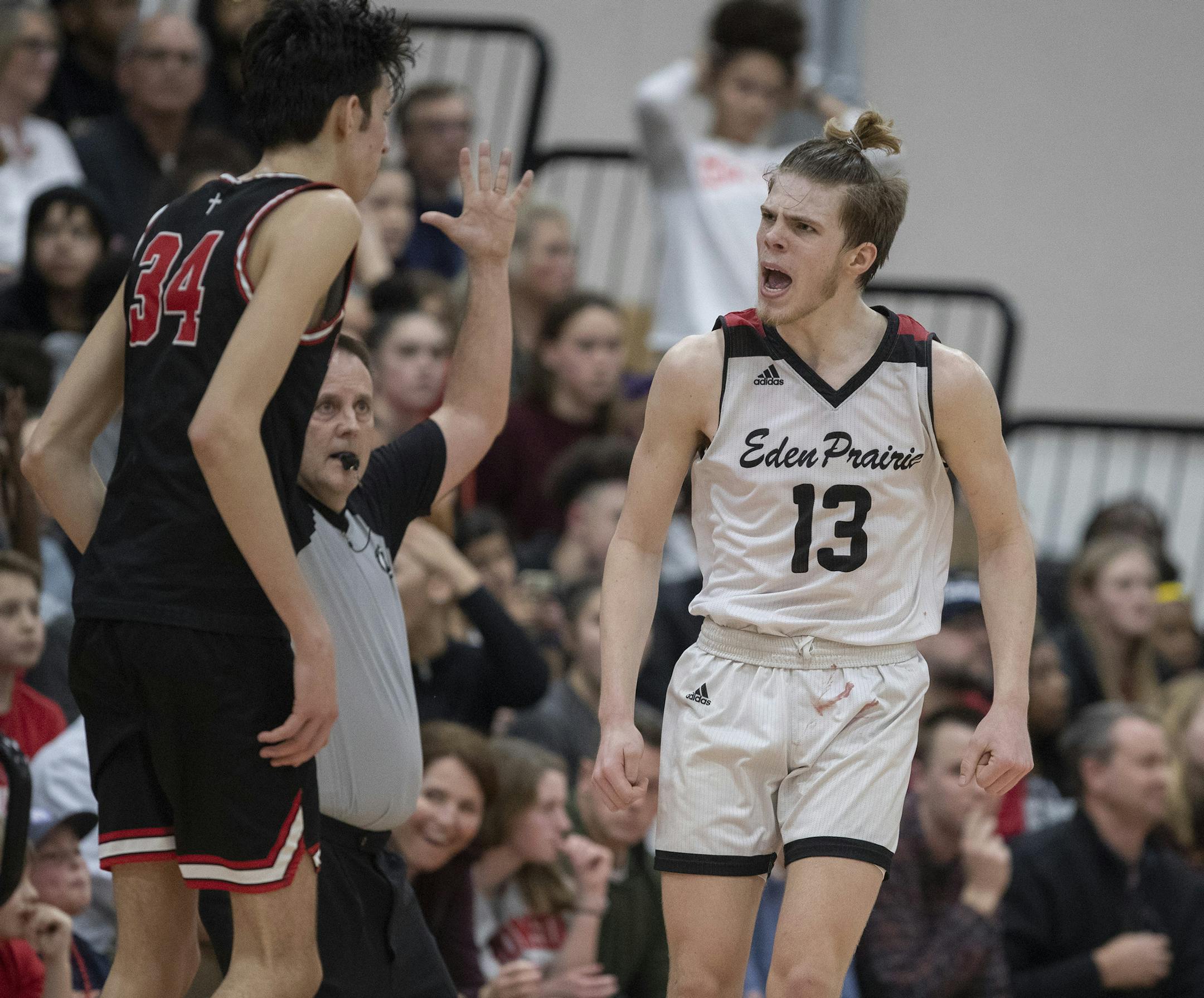 John Henry of Eden Prairie celebrated in front of Chet Holmgren after hitting one of his seven three pointers of the game .] Jerry Holt •Jerry.Holt@startribune.com Eden Prairie defeated Minnehaha Academy 78-64February 18, 2020 in Minneapolis, MN.