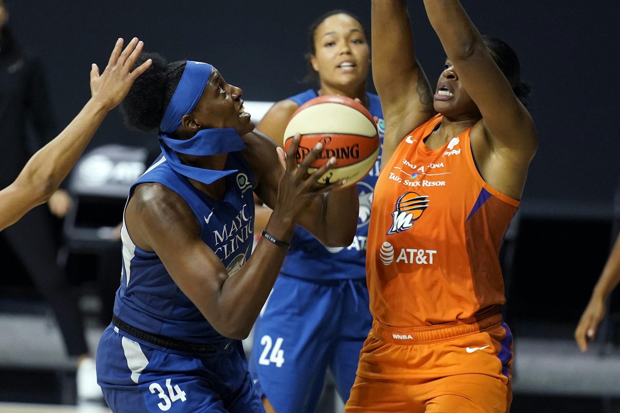 Minnesota Lynx center Sylvia Fowles (34) goes up against Phoenix Mercury center Kia Vaughn (1) during the second half of a WNBA playoff basketball game Thursday, Sept. 17, 2020, in Bradenton, Fla. (AP Photo/Chris O'Meara)