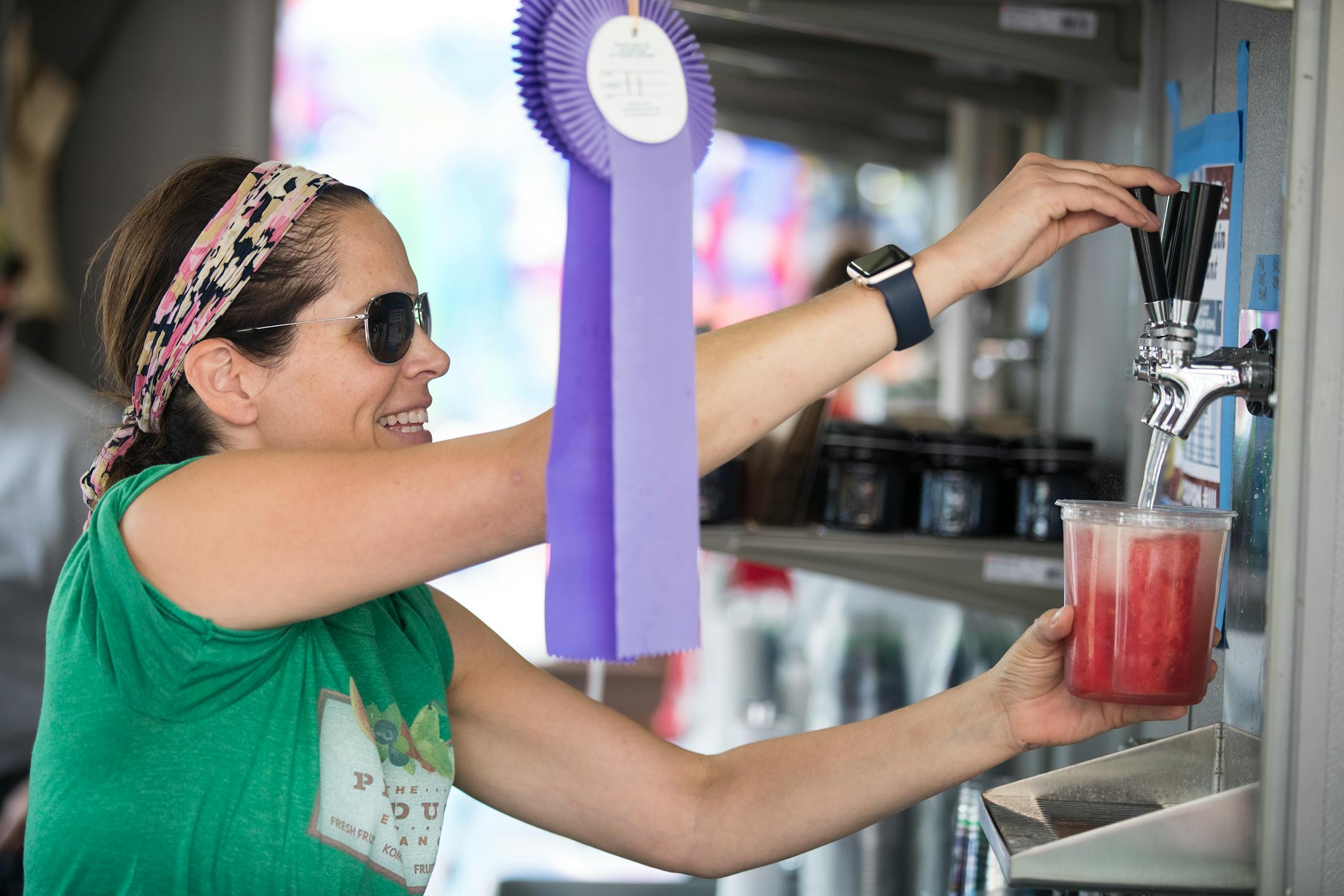 Sharon Hannigan, owner of the Produce Exchange, serves up some Fruit and Booch, watermelon spears with lemon kombucha. ] (Leila Navidi/Star Tribune) leila.navidi@startribune.com BACKGROUND INFORMATION: Food at the Minnesota State Fair on Thursday, August 25, 2016. Rick Nelson reviews the new food this year.