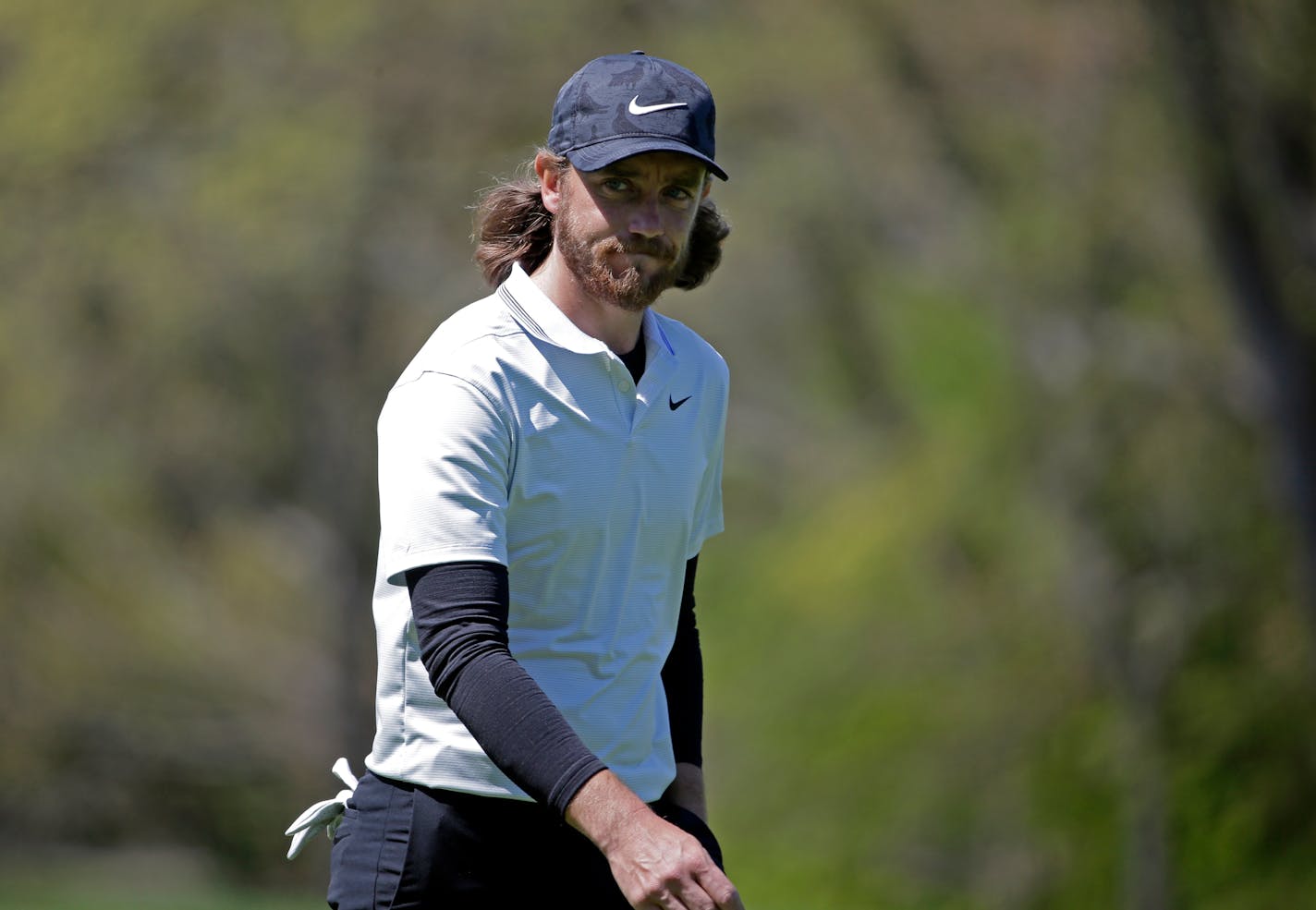 Tommy Fleetwood, of England, walks on the fourth green during the first round of the PGA Championship golf tournament, Thursday, May 16, 2019, at Bethpage Black in Farmingdale, N.Y. (AP Photo/Seth Wenig)