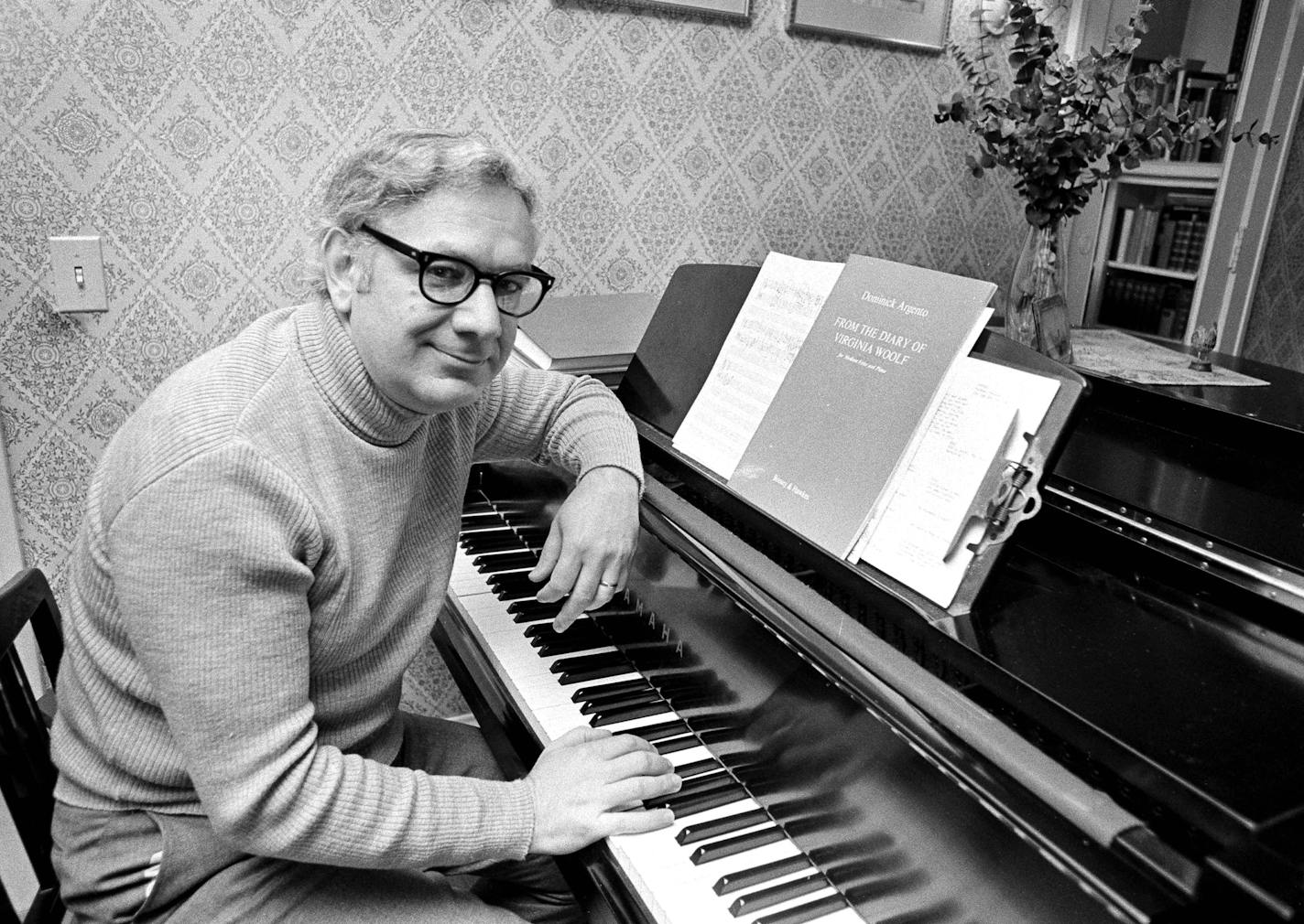 FILE - This May 5, 1975 file photo shows Dominick Argento at his piano in his Minneapolis home after learning he had been awarded the Pulitzer Prize for music. Argento died Wednesday, Feb. 20, 2019, in Minneapolis, according to Carol Ann Cheung, a spokeswoman for his music publisher, Boosey & Hawkes. He was 91. (AP Photo, File)