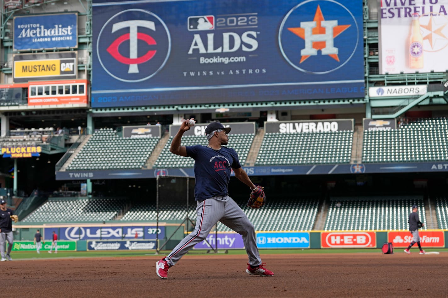 Minnesota Twins' Jorge Polanco fields a ground ball during an ALDS baseball workout Friday, Oct. 6, 2023, in Houston. The Twins will play the Houston Astros in Game 1 of an ALDS series Saturday. (AP Photo/David J. Phillip)