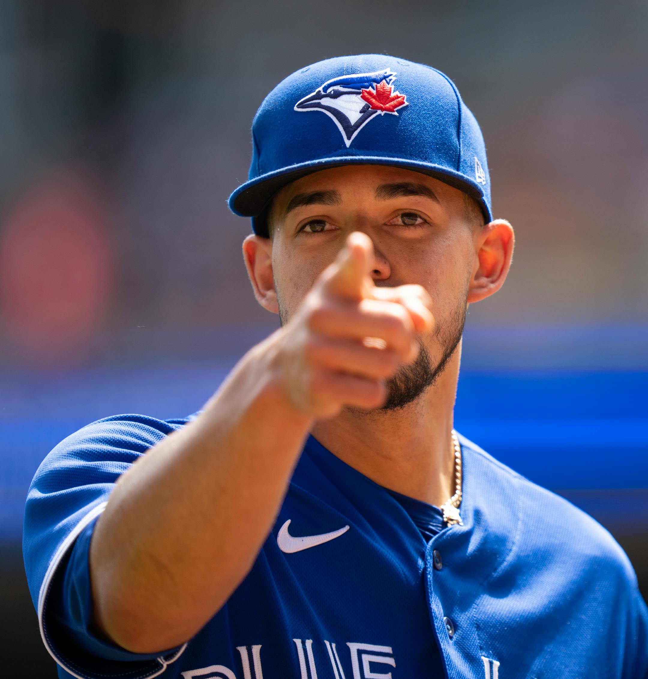 Toronto Blue Jays starting pitcher Jose Berrios (17) pointed to friends in the stands as he walked towards the dugout after the third inning.
