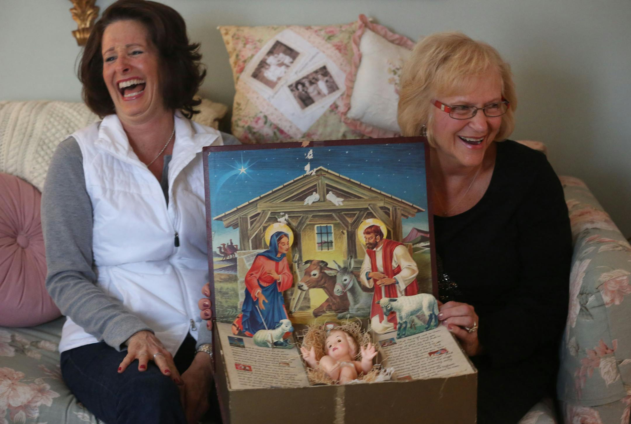 Lorna Johnston, right and her daughter Jane Morimoto held the family's Nativity scene in their laps in Johnston's home in Long Lake Friday, December 13, 2013. Morimoto has been promised the heirloom will be passed down to her which was once own by her grandmother. ] (KYNDELL HARKNESS/STAR TRIBUNE) kyndell.harkness@startribune.com