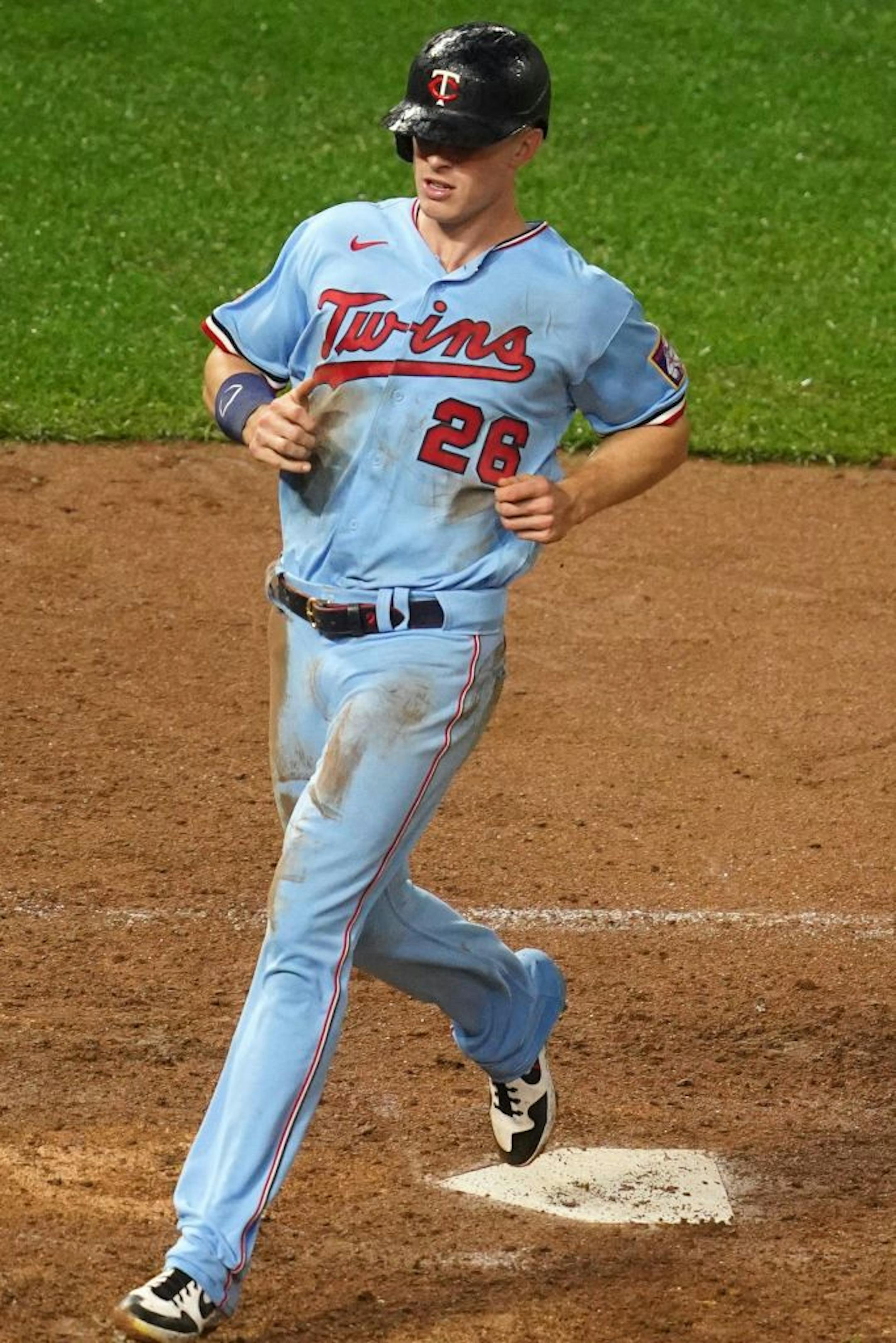 Minnesota Twins right fielder Max Kepler (26) scored on a sacrifice double play off a ball hit by Minnesota Twins left fielder Eddie Rosario (20) in the seventh inning.