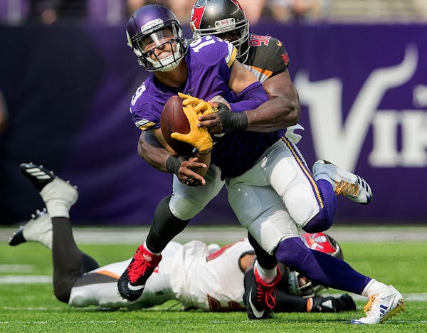 Minnesota Vikings Adam Thielen (19) was tackled after a catch in the second quarter.