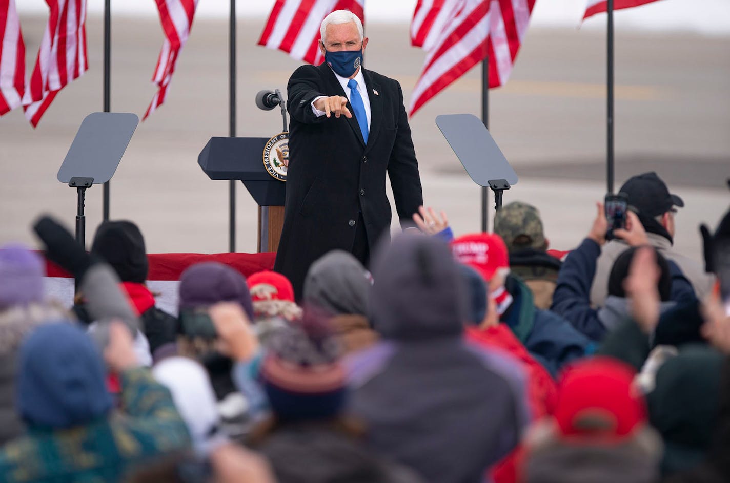 Vice President Mike Pence pointed to an attendee at the conclusion of his speech at Range Regional Airport in Hibbing, Minn. on Monday afternoon.