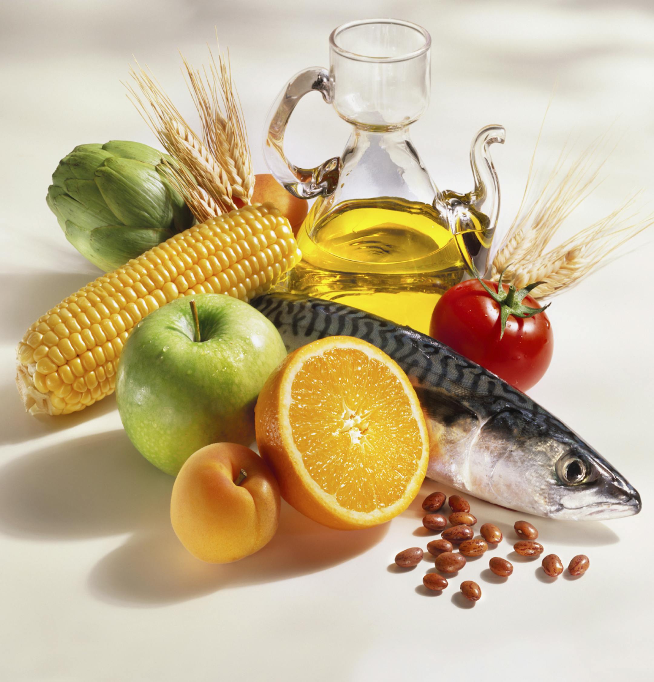 A beautiful group of products, (Fish, fruit, vegetables, cereals, beans, and olive oil) typical in the mediterranean diet