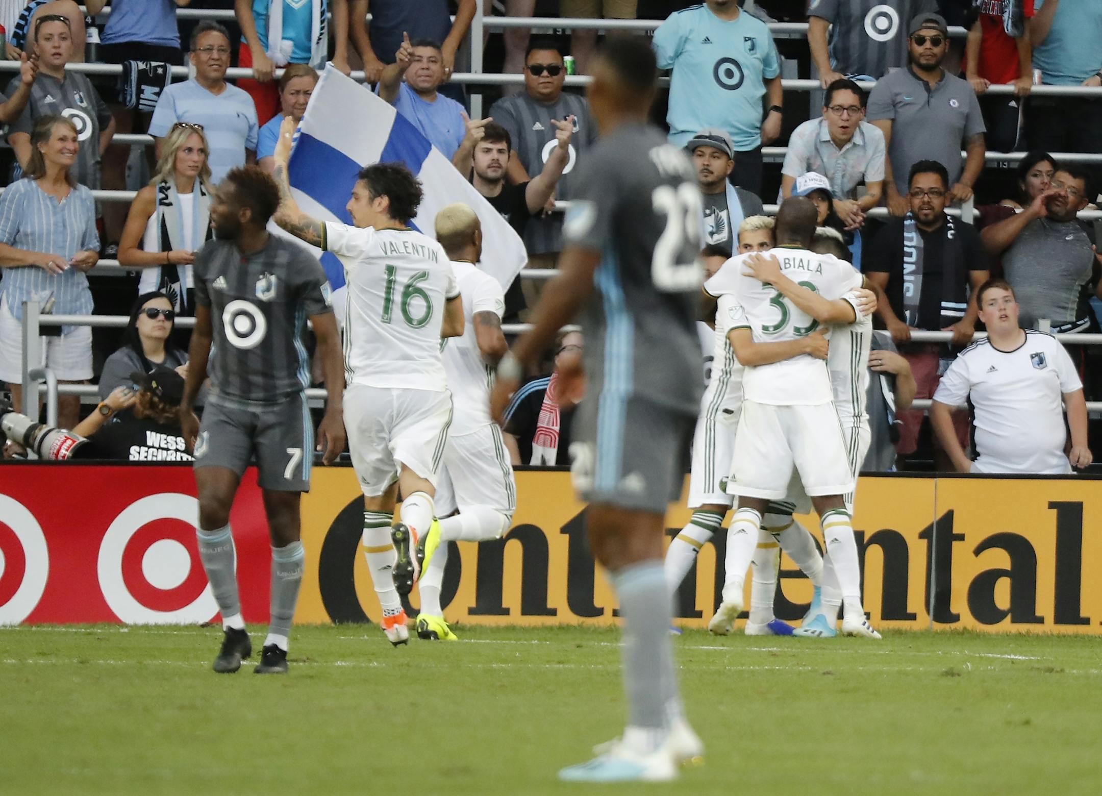 Portland Timbers players celebrate a goal during the first half.