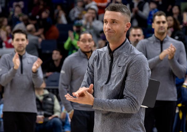 Denver assistant coach Ryan Saunders was acknowledged by the Target Center crowd before a game against the Wolves last season.