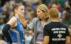 Minnesota Lynx head coach Cheryl Reeve gives instructions to guard Lindsay Whalen (13) during a timeout.