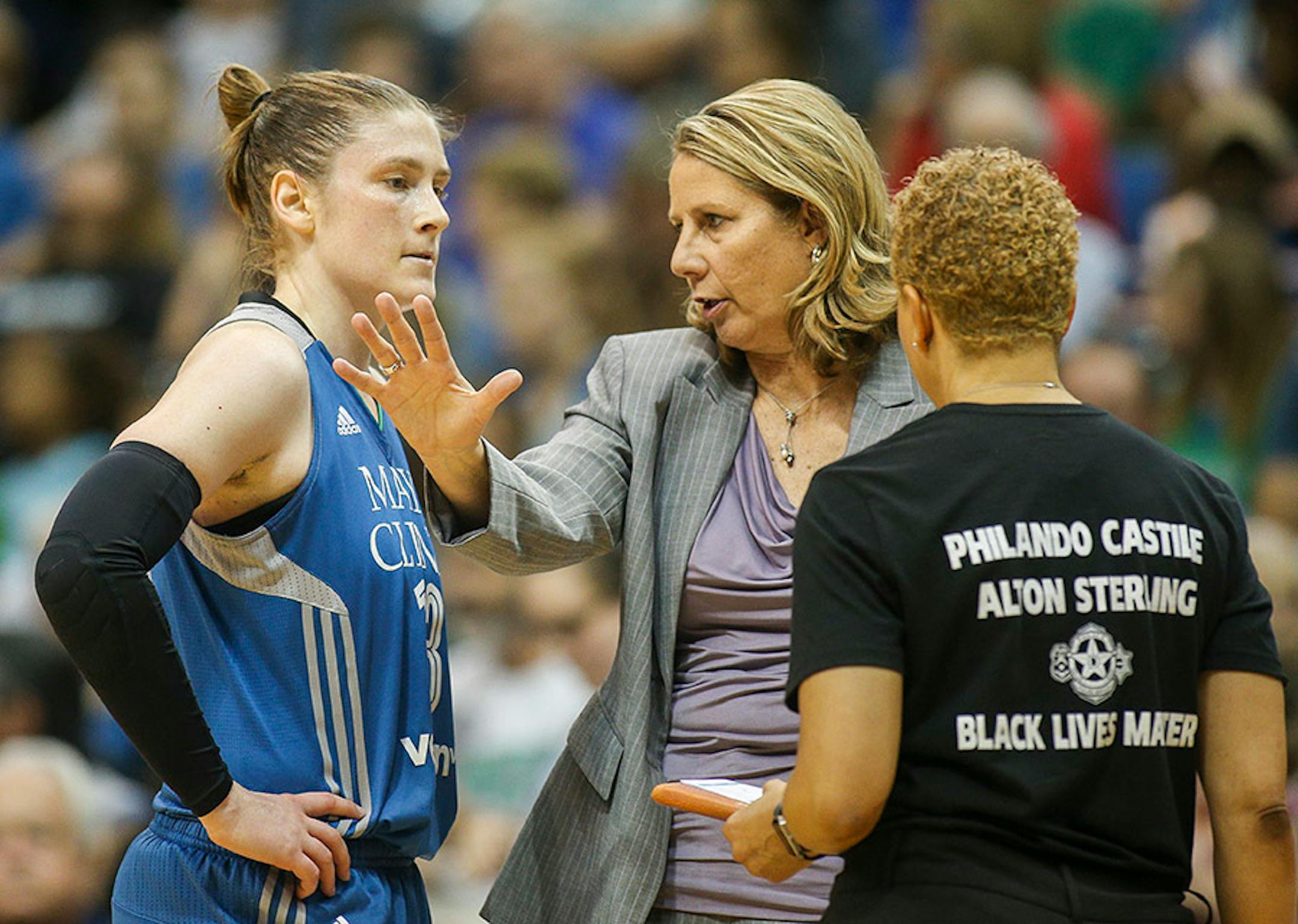 Minnesota Lynx head coach Cheryl Reeve gives instructions to guard Lindsay Whalen (13) during a timeout.