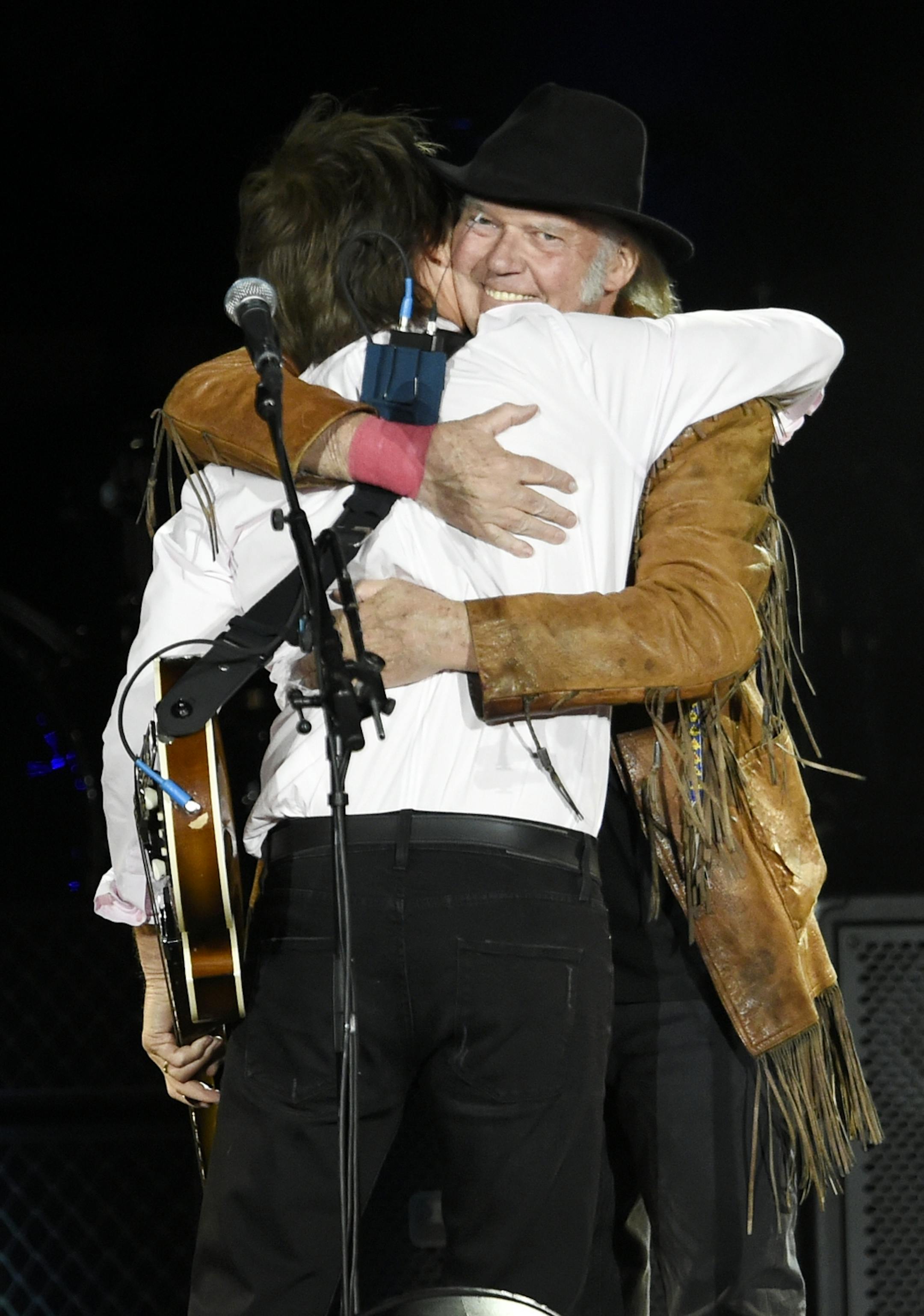 Paul McCartney, left, is joined onstage by Neil Young during his performance on day 2 of the 2016 Desert Trip music festival at Empire Polo Field on Saturday, Oct. 8, 2016, in Indio, Calif.